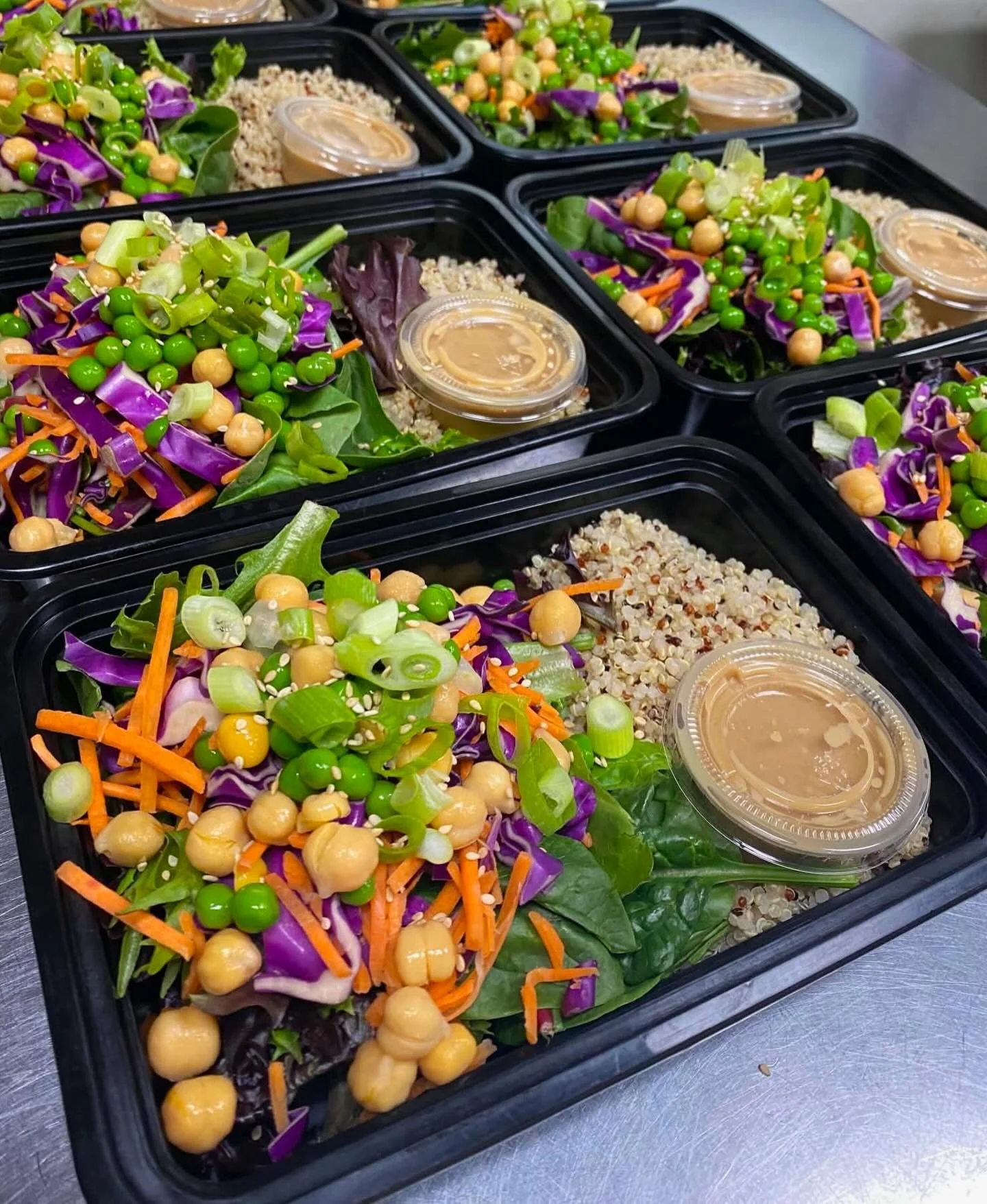 ☀️ Summer vibes are in full effect at The Purple Porch today, and we are NOT holding back! 🌾✨

Grab our housemade Tahini Grain Bowl from the Grab N&rsquo; Go case &mdash; organic quinoa, spring greens, carrots, peas, garbanzo beans, purple cabbage, 