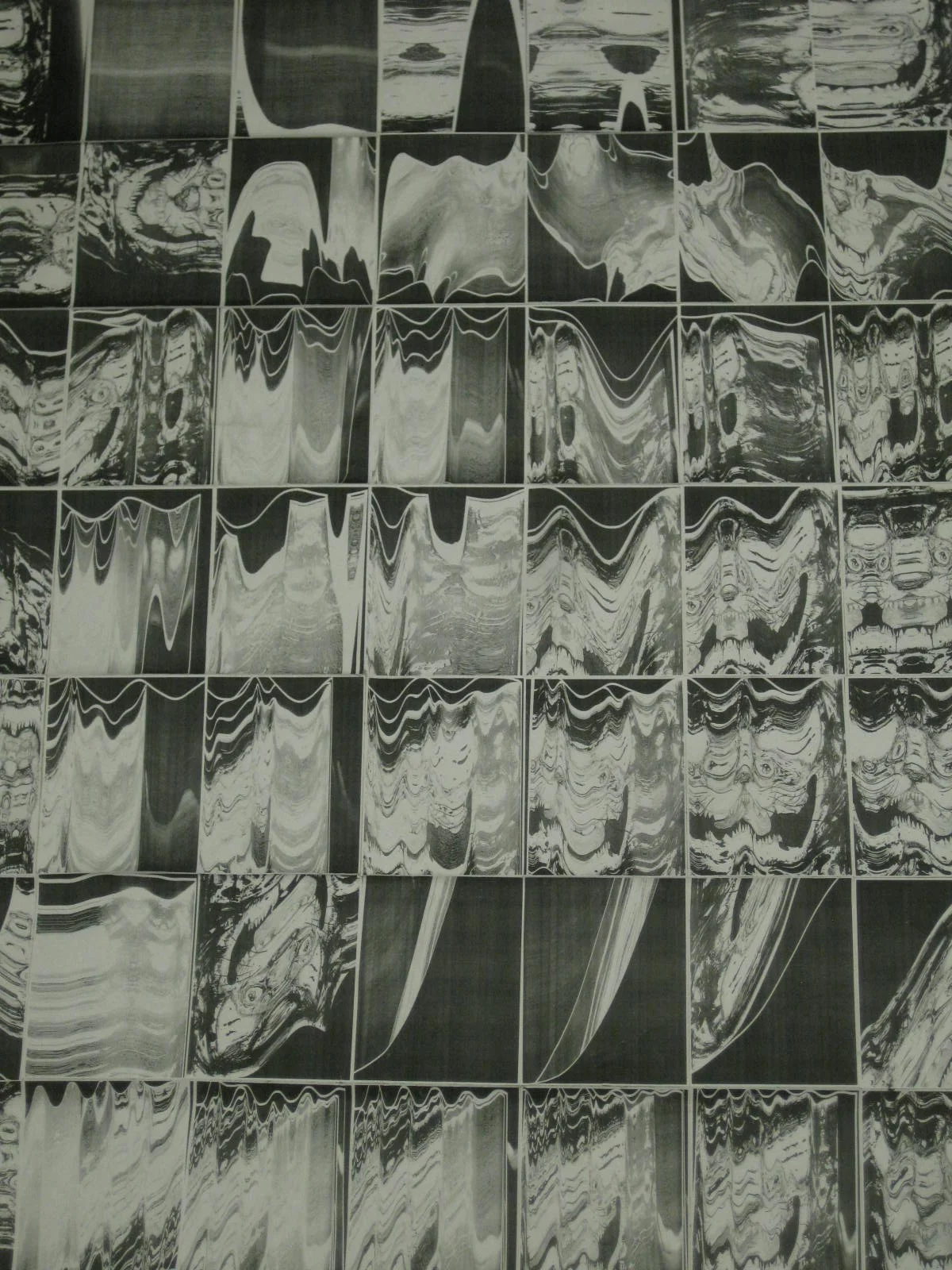   Mark Teshirogi    2011 Major: Fine Arts, Creative Writing Senior   Ink and Zerox   I chose the character, the Cheshire Cat, and recreated him using my own visual style. This character was specifically selected for its cultural familiarity and its r