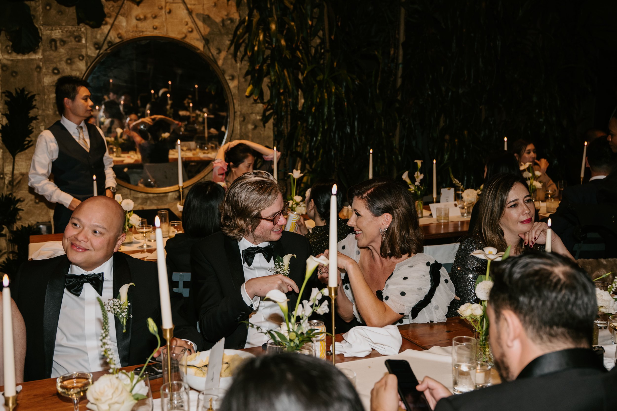 wedding guest chatting to each other sitting at the reception table