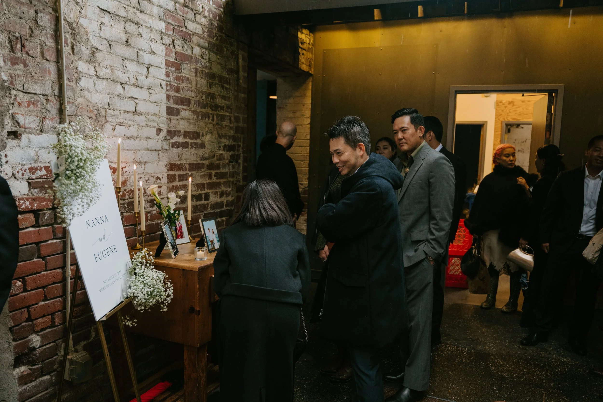 wedding guest arriving for ceremony and chatting with each other.
