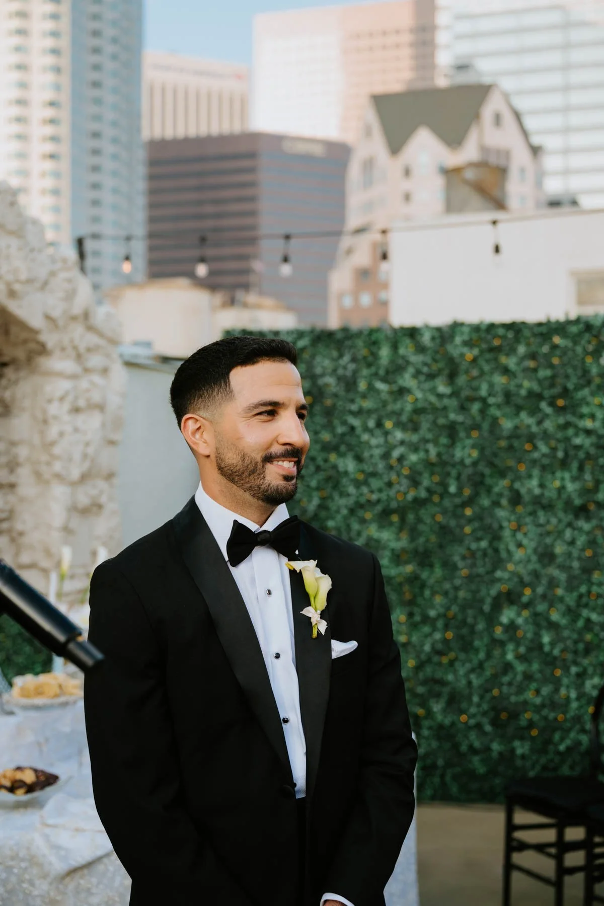 Groom smiling look down the aisle