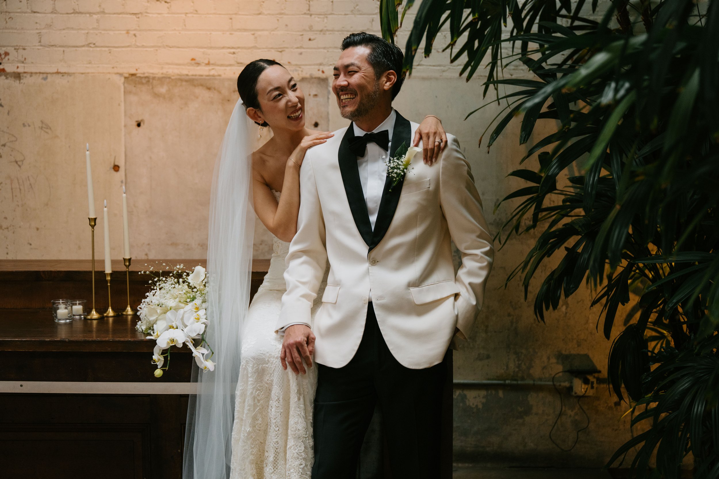 Bride and groom laughing together