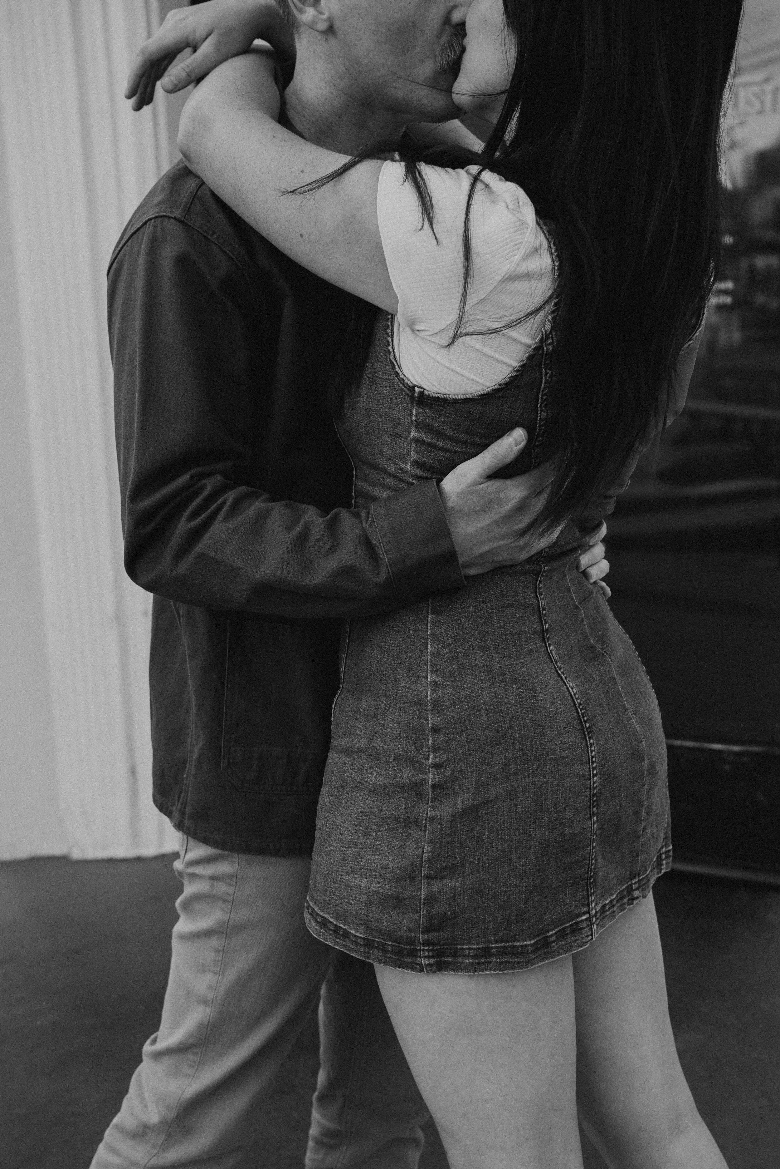 black and white close up photo of couple kissing