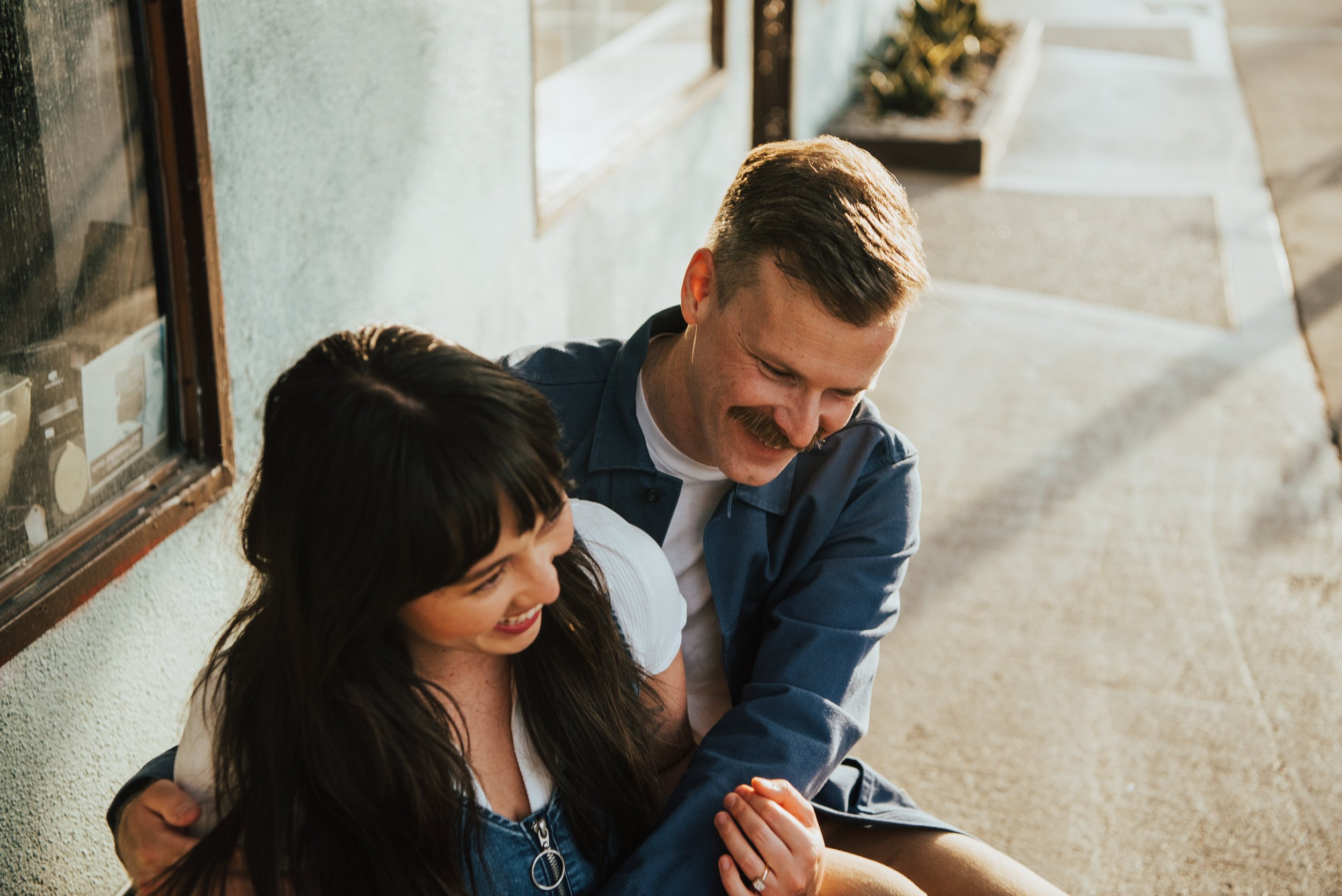 couple sitting and laughing together