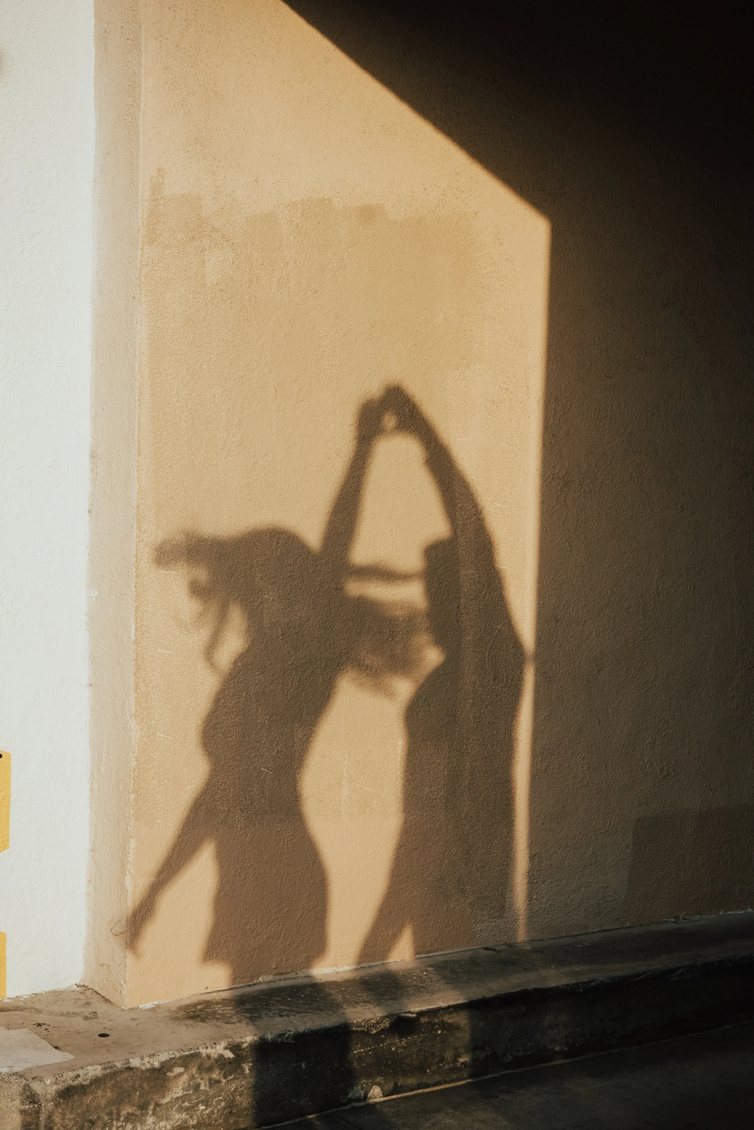 photo of the shadows of a guy twirling a girl