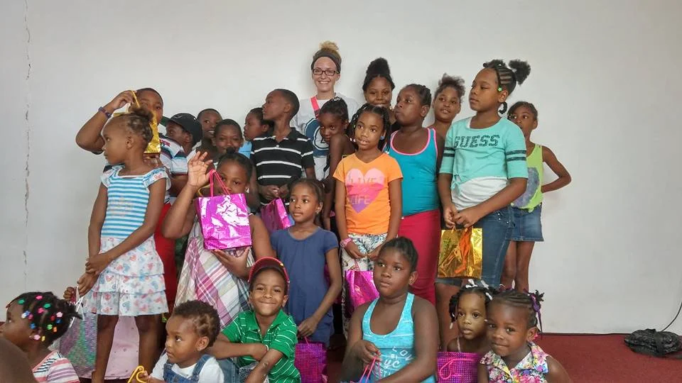 2016 Summer MIssion Adventure participants pose with Kids they just ministered to in Castries