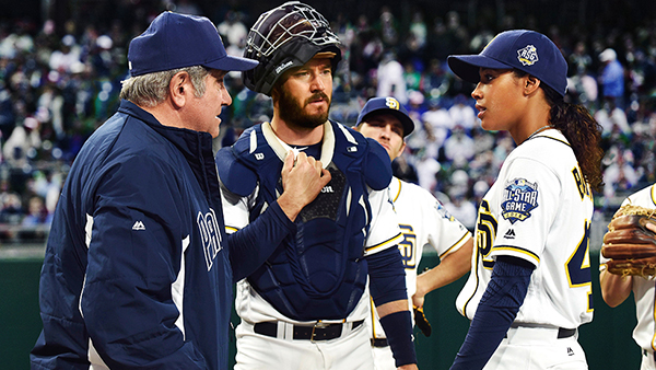 Ginny Baker (Kylie Bunbury, right) having a chat on the mound with coach Al Luongo (Dan Lauria, left) and catcher Mike Lawson (Mark-Paul Gosselaar, middle).