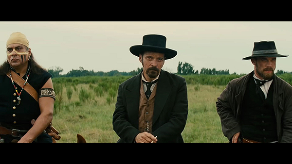 Bartholomew Bogue (Peter Sarsgaard, center) receives slightly more focus than films prior, as do his lieutenants Denali (Jonathan Joss, left) and McCann (Cam Gigandet, right).