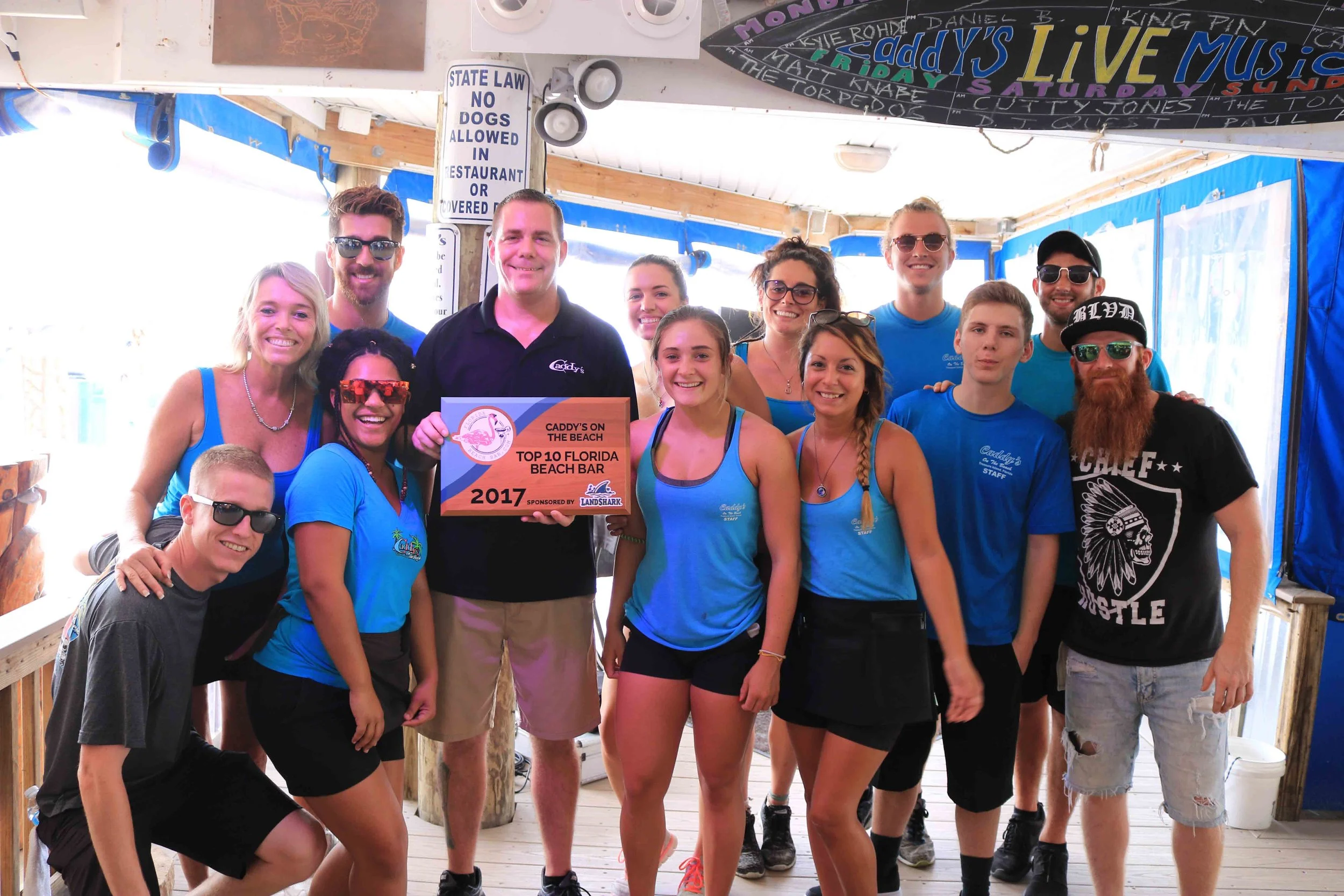 The staff of Caddy's on the Beach pose with the 2017 Florida Beach Bar award 
