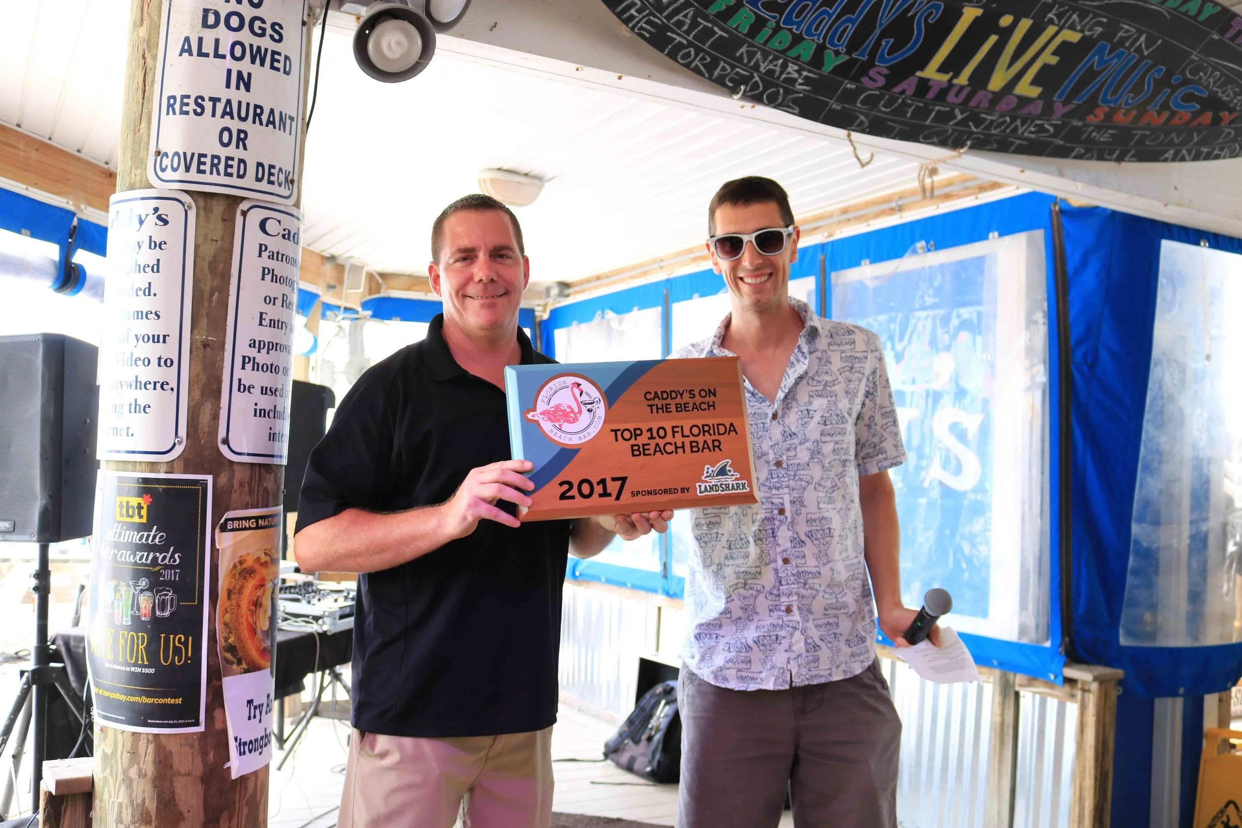 Caddy's General manager, Chris, accepts the 2017 Top 10 Florida Beach Bar award