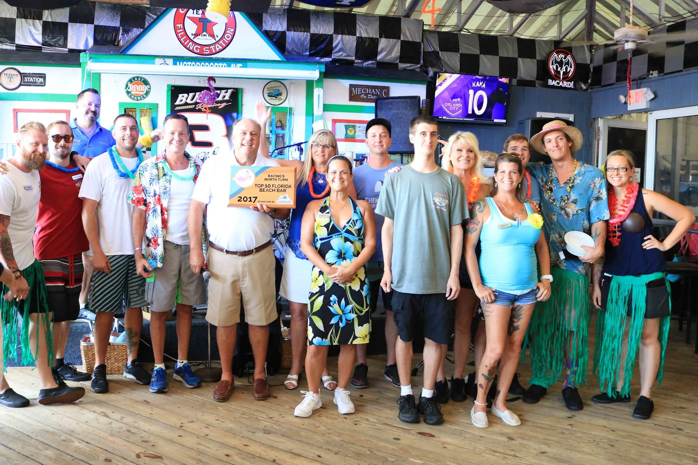 The staff of Racing's North Turn pose with the 2017 Florida Beach Bar award 
