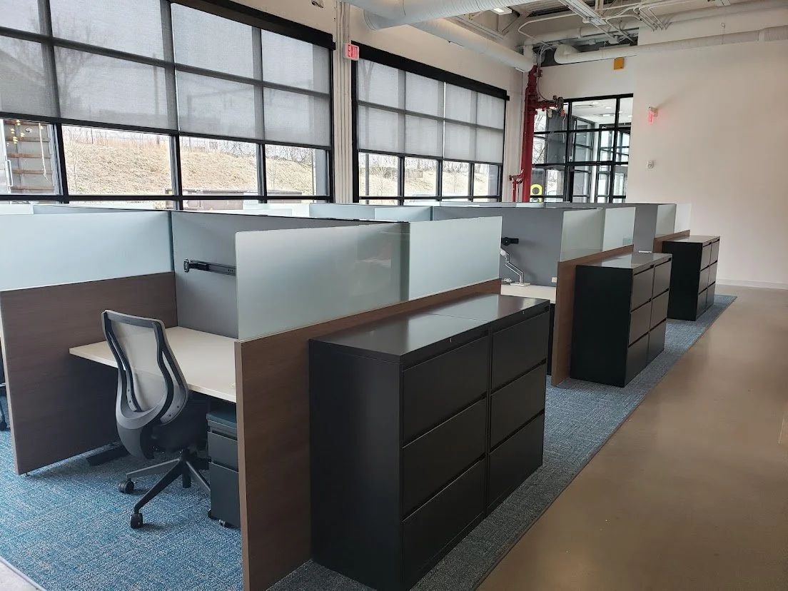 Cubicles with frosted glass, task chairs and file cabinets. Installed by Premier Office Installation in the Northeast