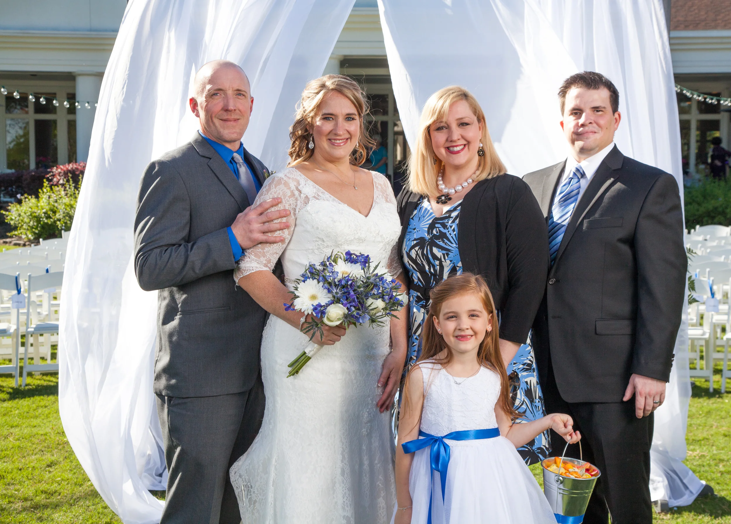 More group portraits with the arbor draped in shear white fabric at the background.