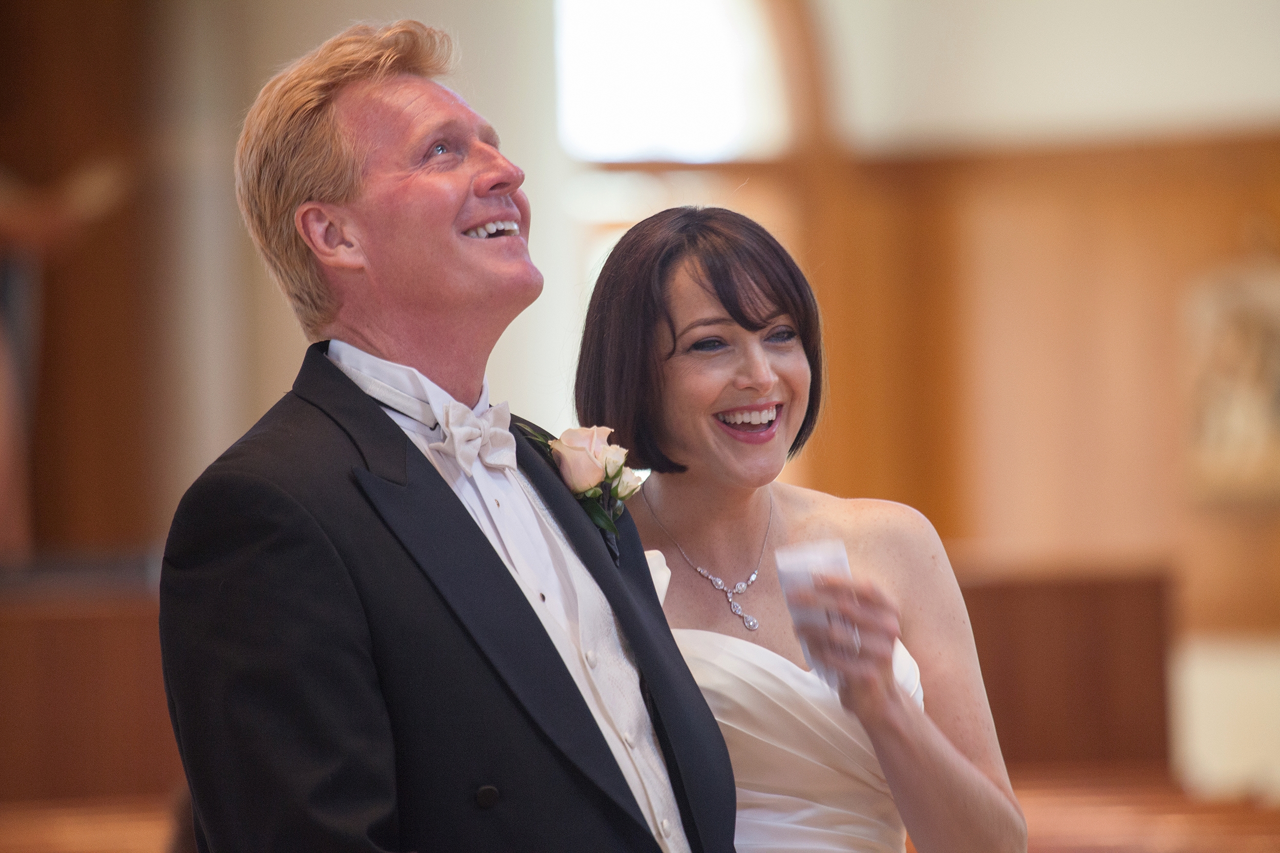The groom looks to heaven with tears in his eyes in gratitude after marrying his best friend during the wedding ceremony in Houston, Tx.