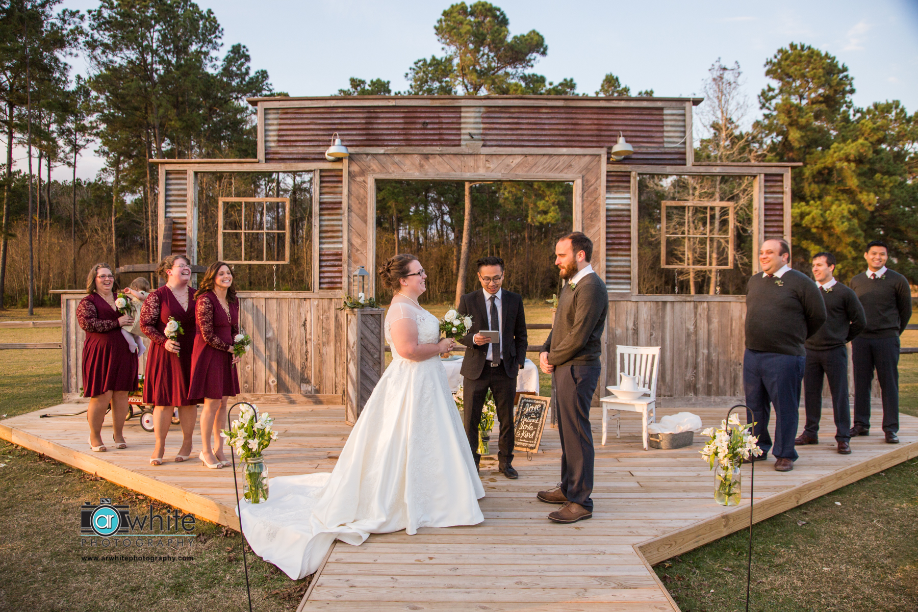 Wedding ceremony on a farm wedding and event barn venue.