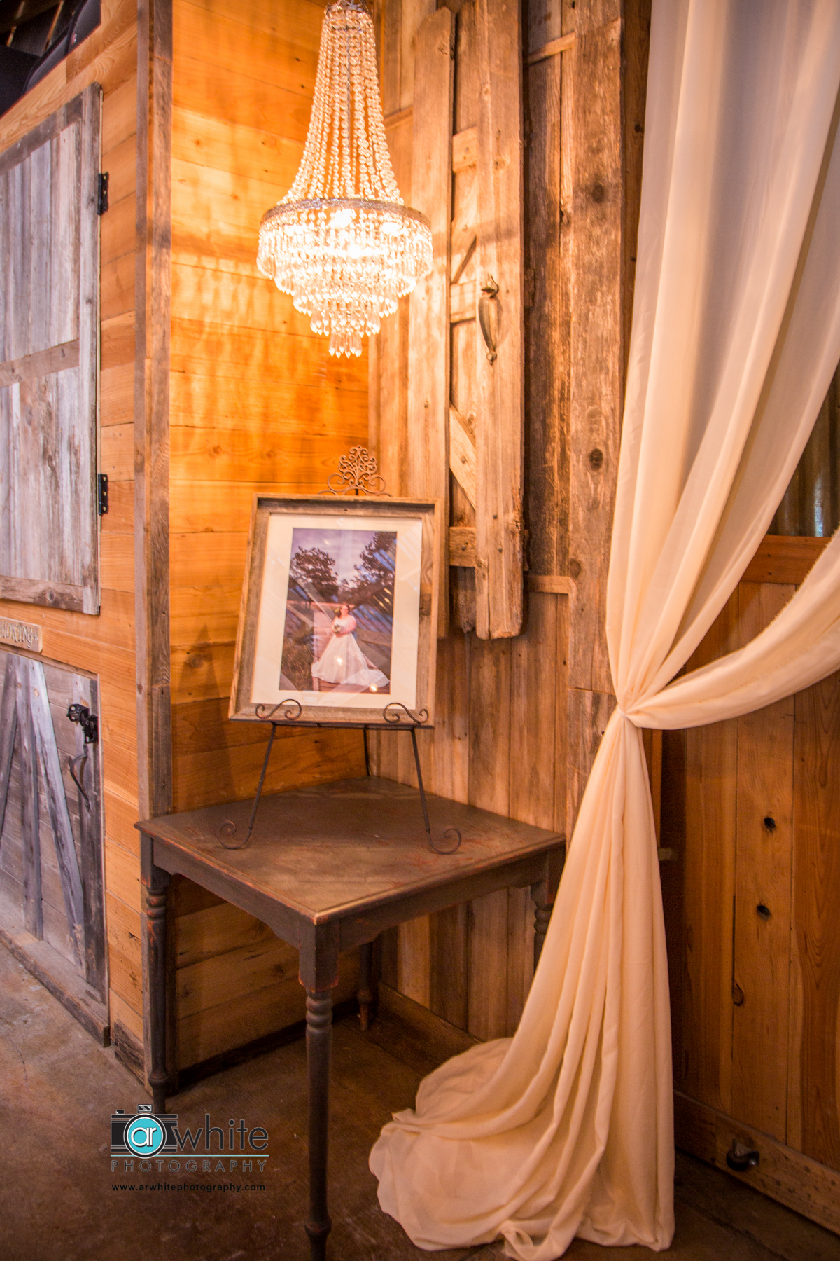 Detail of a photo display area at a barn wedding.