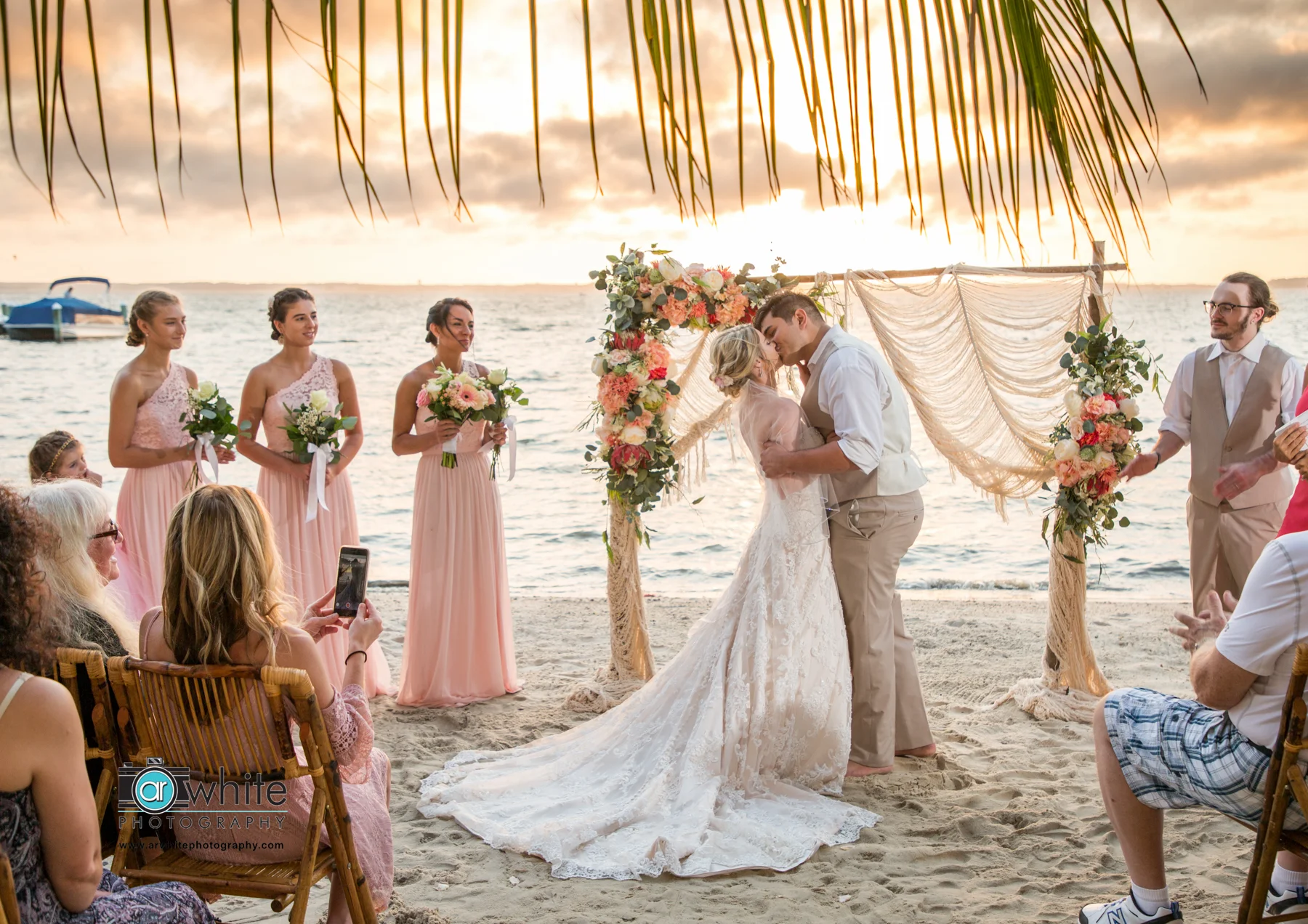 Newly weds kiss for the first time as husband and wife.