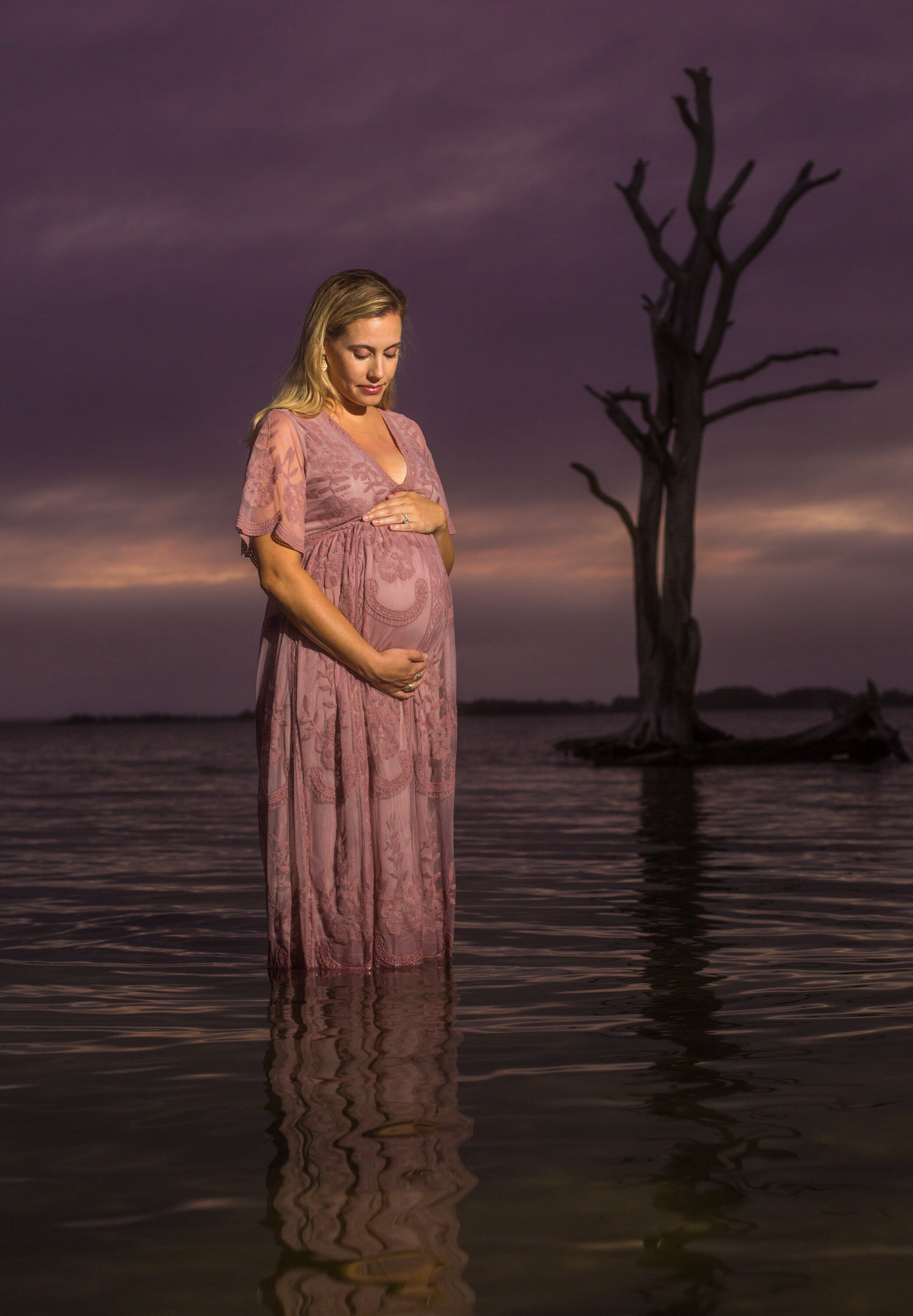 Photo of a pregnant woman on the water on the beaches of Assateague during her Ocean City Maryland session taken by photographers in OCMD ARWhite Photography. (Copy)