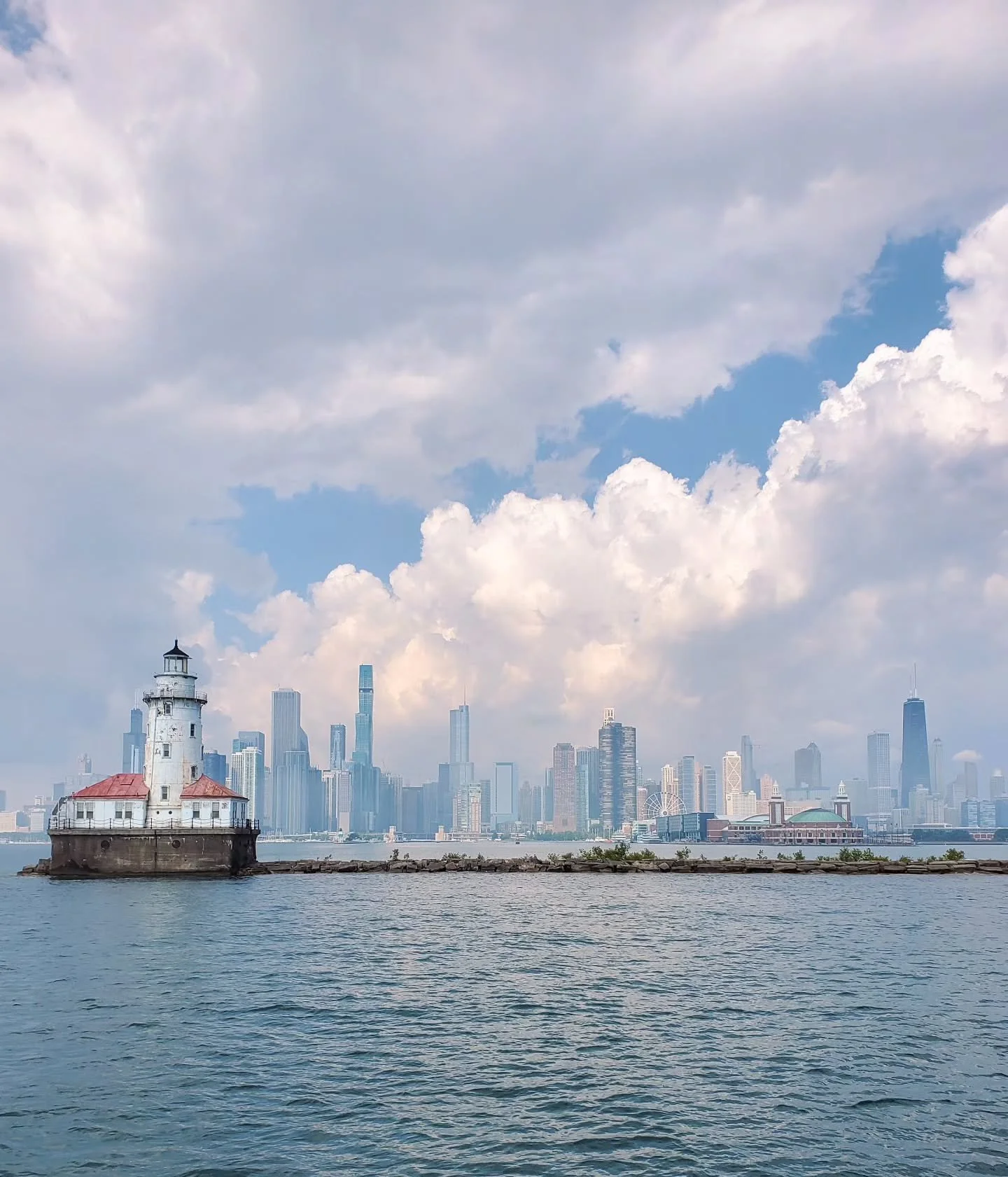 Happy National Lighthouse Day!

One of our favorite photos is of the Chicago Harbor Lighthouse on Lake Michigan near Navy Pier. It was built during the World's Fair in 1893, and is the last remaining lighthouse in Chicago. Can you imagine what this l