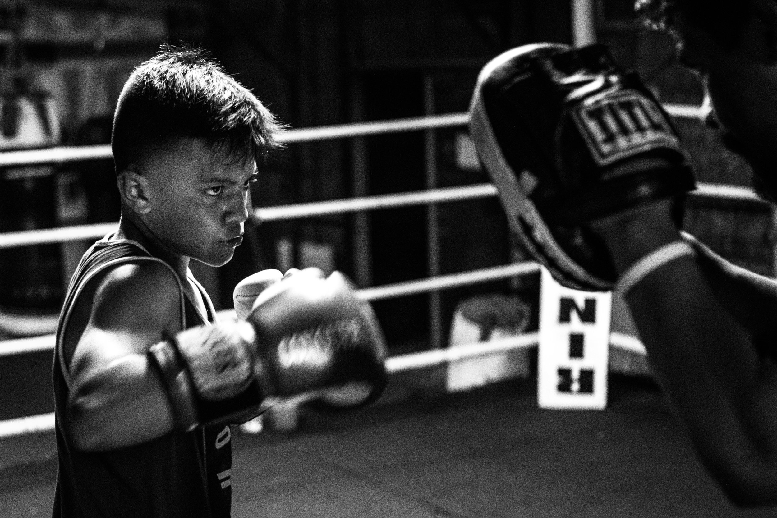  After the day's training drills are complete, AJ Ramos, 13, &nbsp;goes through punching exercises with his father and owner of Ramos Boxing, Arturo Ramos III. The younger Ramos is currently ranked #5 in the nation for the 13- to 14-year-old,&nbsp;85