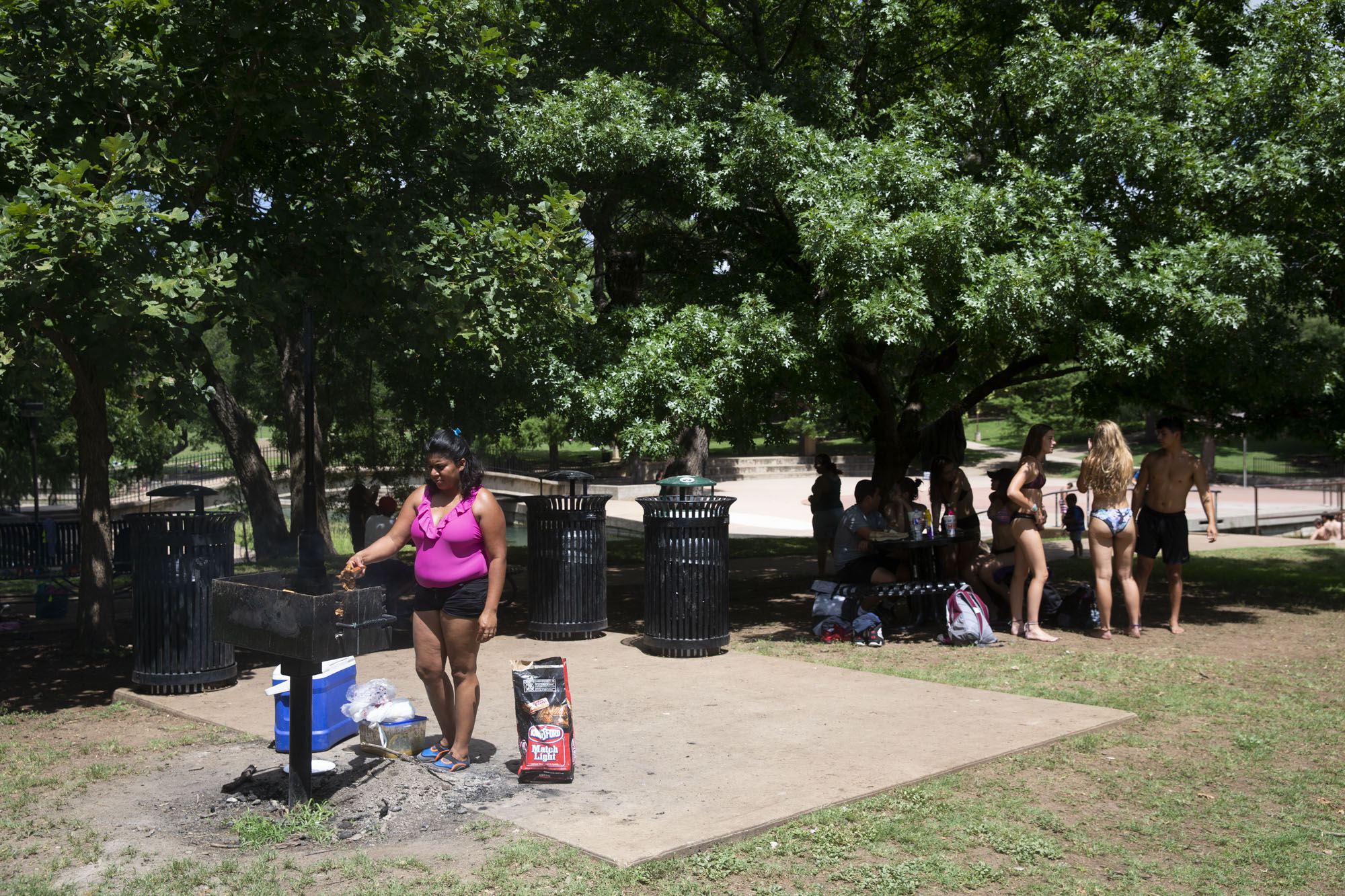  Lizeth Rosales, an asylum recipient from Honduras, grills meat at Texas State University’s Sewell Park in San Marcos on June 28, 2018. Rosales received asylum in May 2017 as a victim of domestic violence, a circumstance that Attorney General Jeff Se