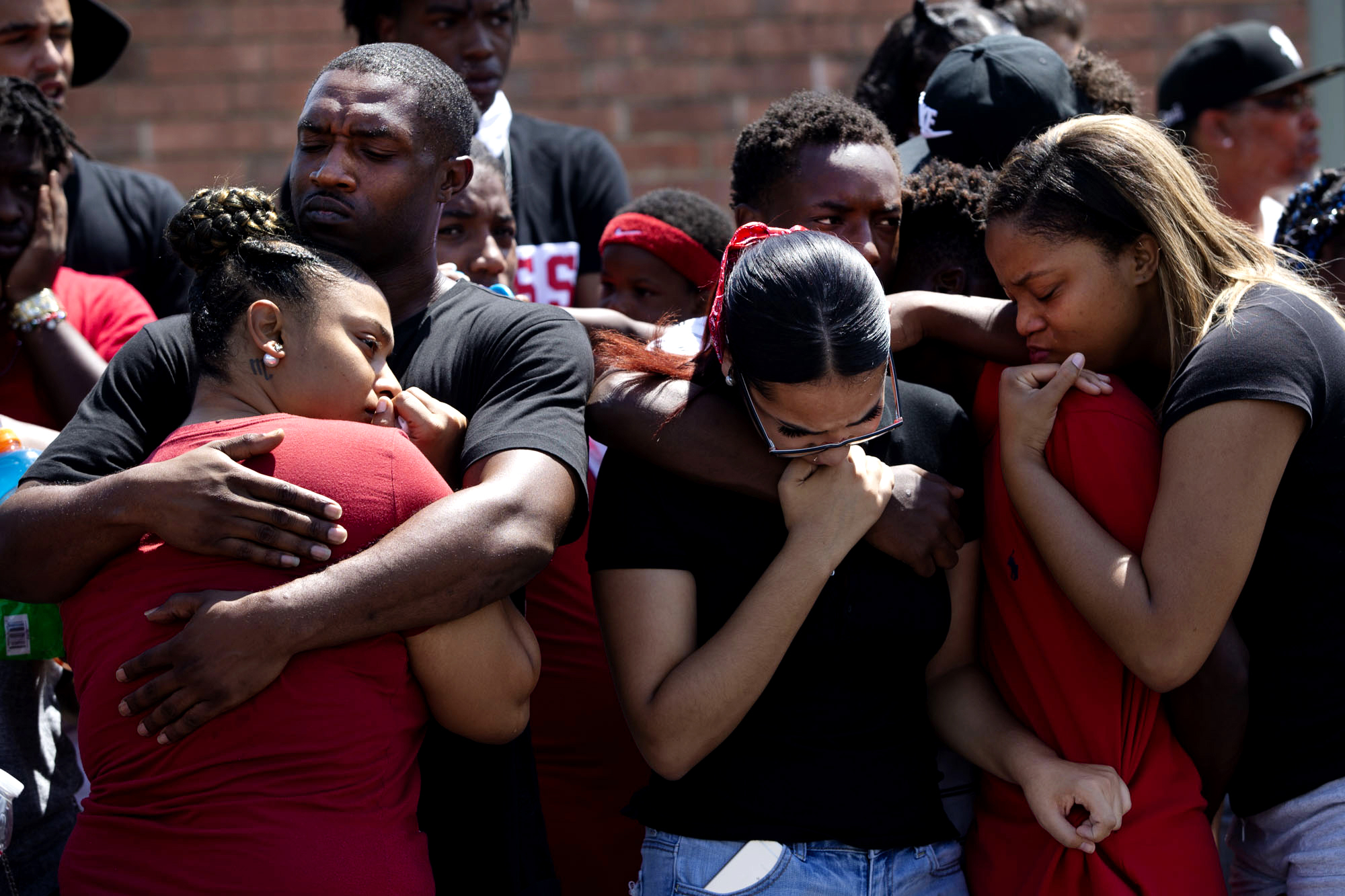  Friends and family members of Devonte Ortiz gather on Friday, July 6, 2018, at Pleasant Hills Apartments in Austin, Texas. Witnesses say Ortiz’ neighbor Jason Roche fatally shot 19-year-old Ortiz in the early hours of July 4 in a dispute about firew