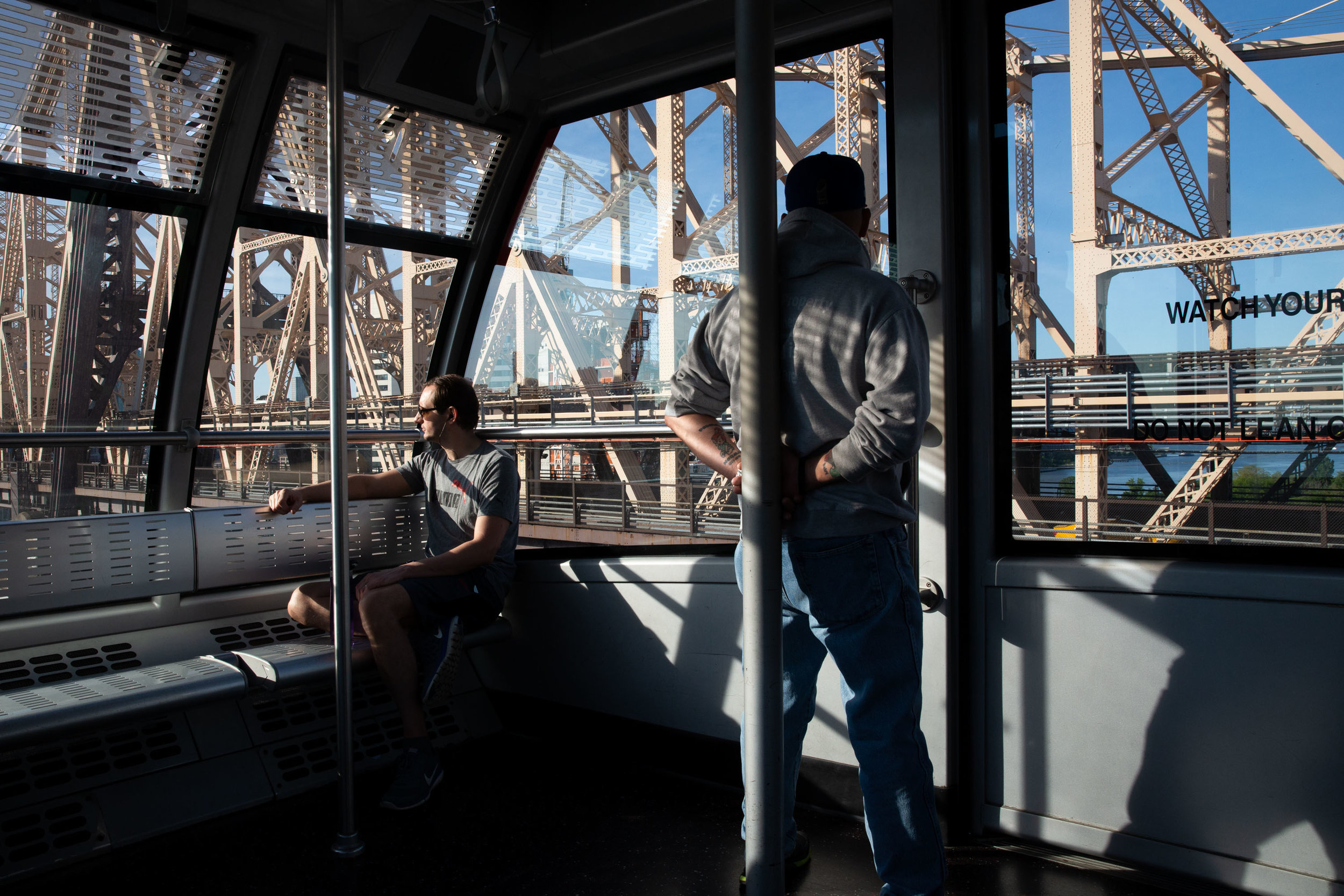  Ian Tyack, 37, from the Upper East Side and Alberto Collazo, 59, from the Bronx commute by using the Tramway Plaza in the Lenox Hill neighborhood on the morning of May 23, 2019. 