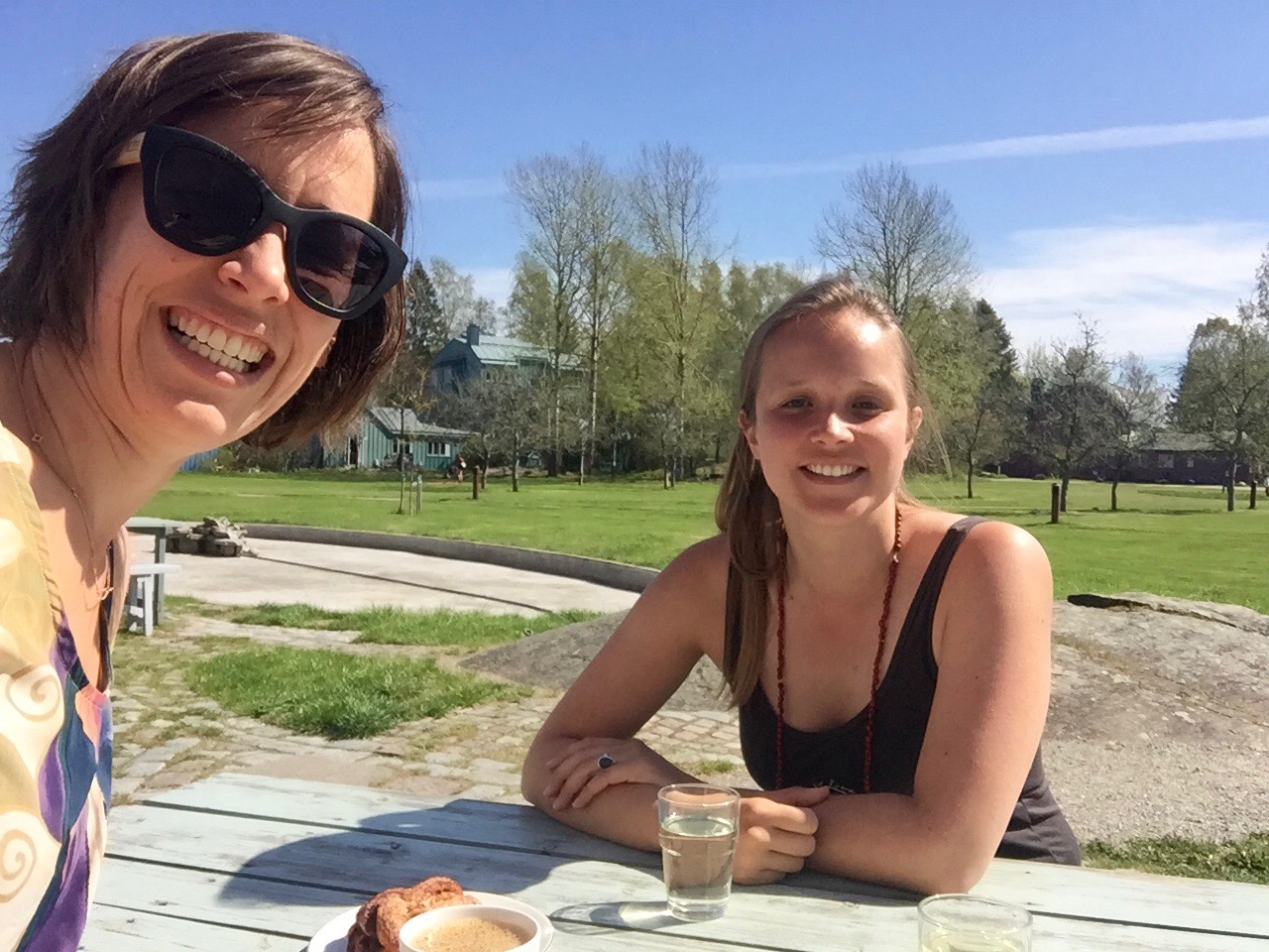 Silvia and I catching a moment of Swedish sun over a kanelbullar (cinnamon bun)!