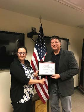 VP, Operational Solutions, Vern Tubbs Presents Kristin Pitts with her Employee of the Quarter Certificate.