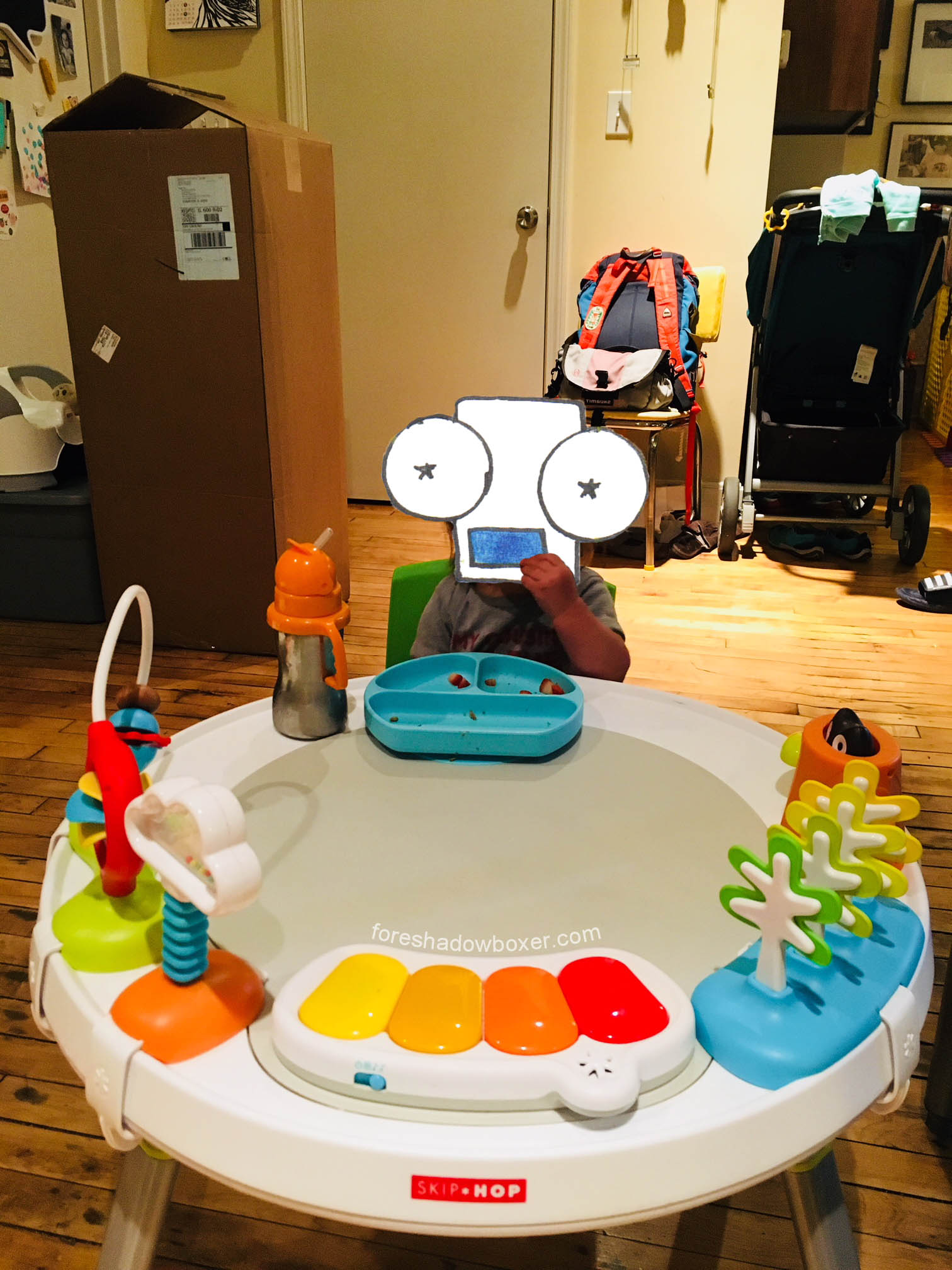 Toys shown are removable; we remove them all when a bigger play/dining/coloring surface is needed.
