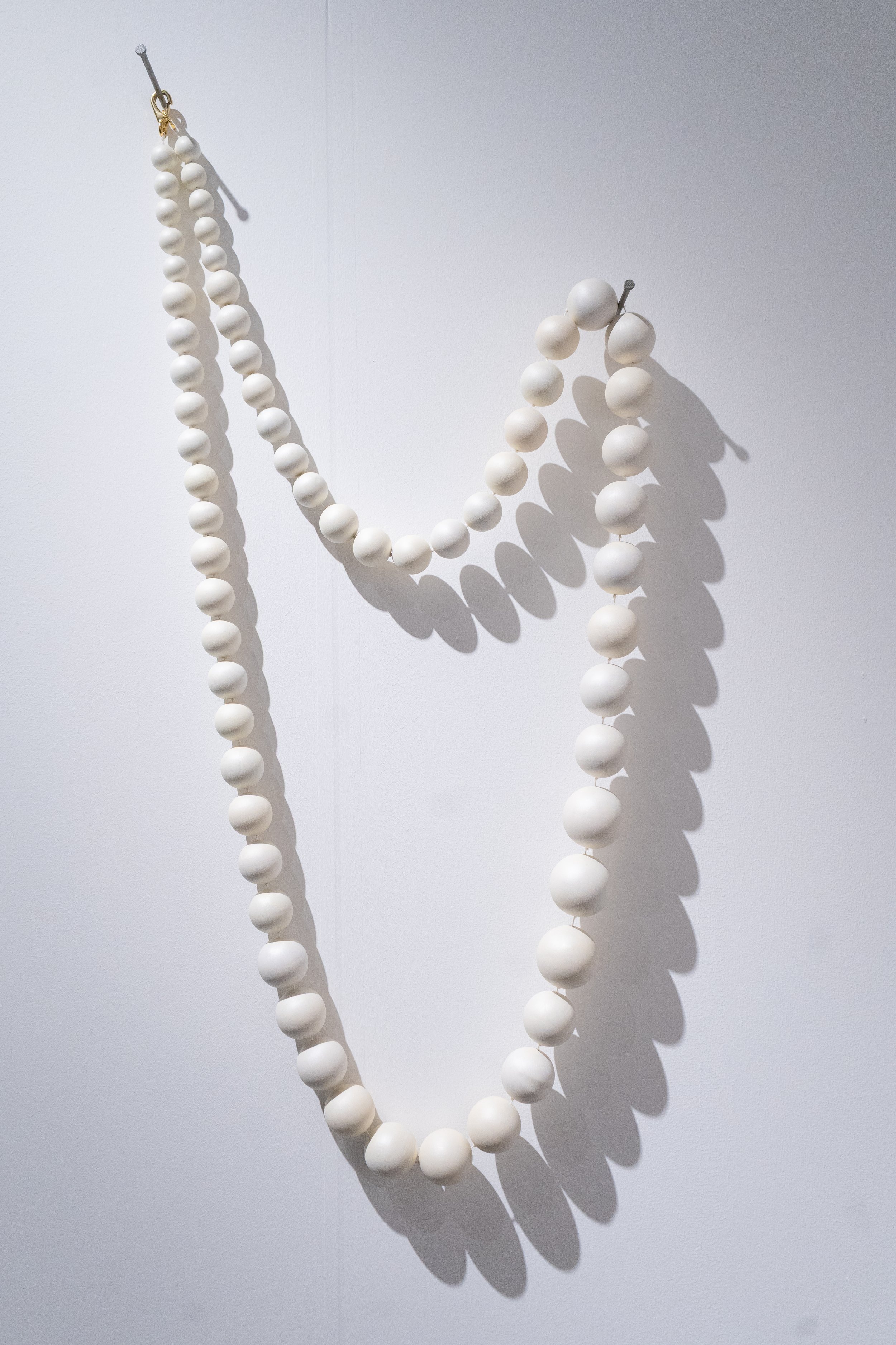   Grave Goods  | 46 × 22 × 3 in | Oil on wood, waxed twine and brass | 2025 
