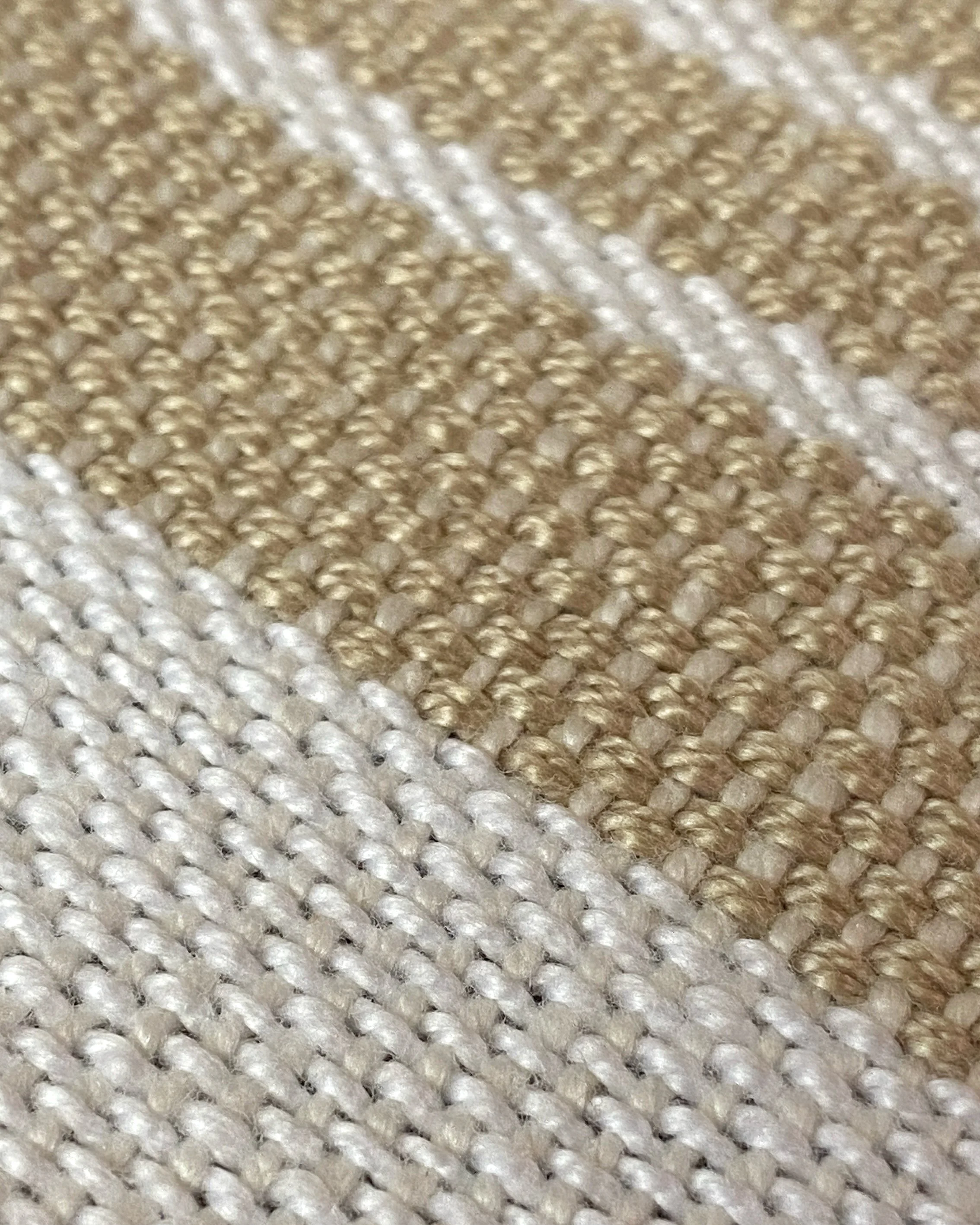 Handwoven towel with random stripes in an assortment of vibrant colors (close-up)