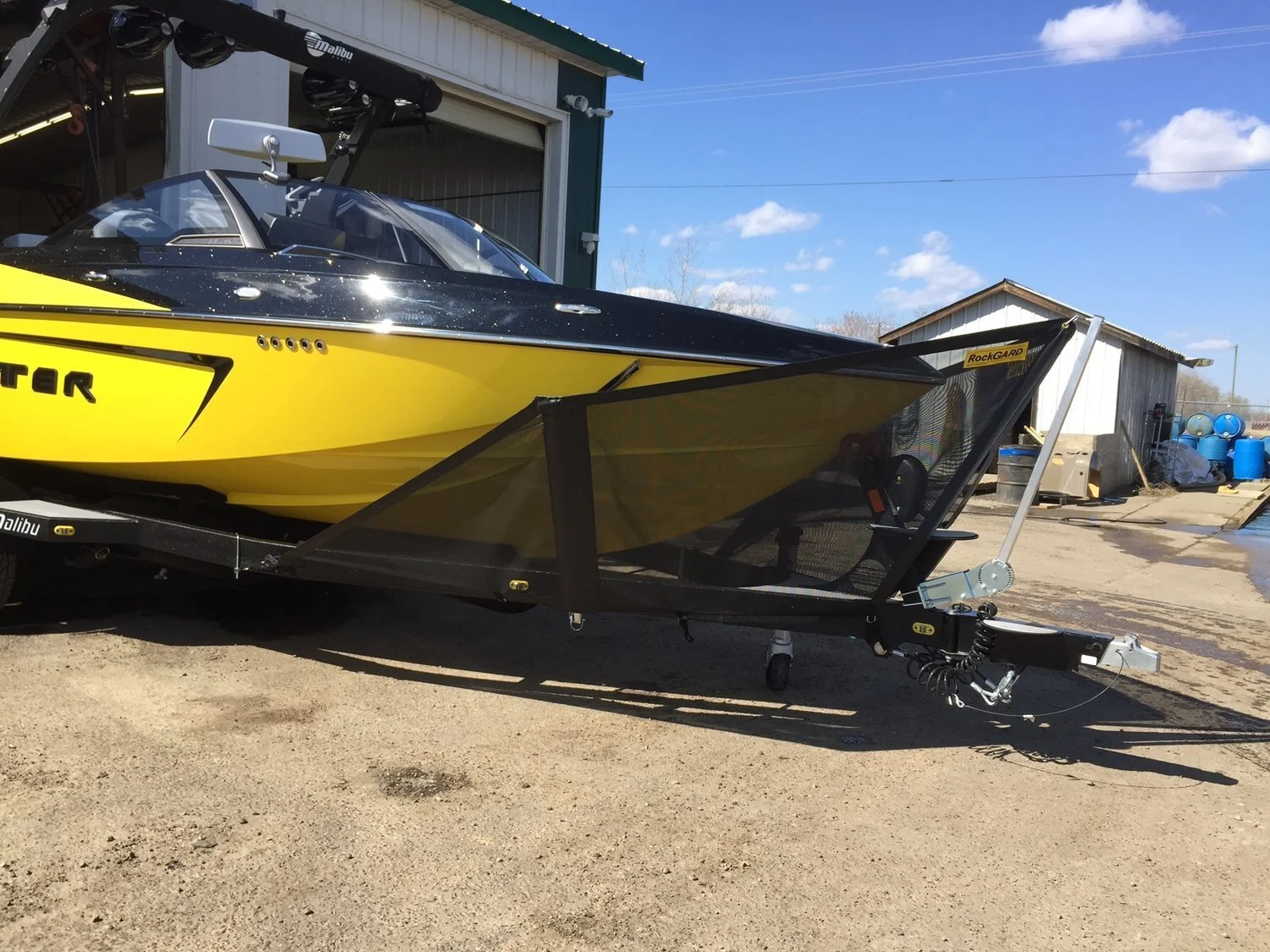 Rock guard V front attached to a yellow speed boat