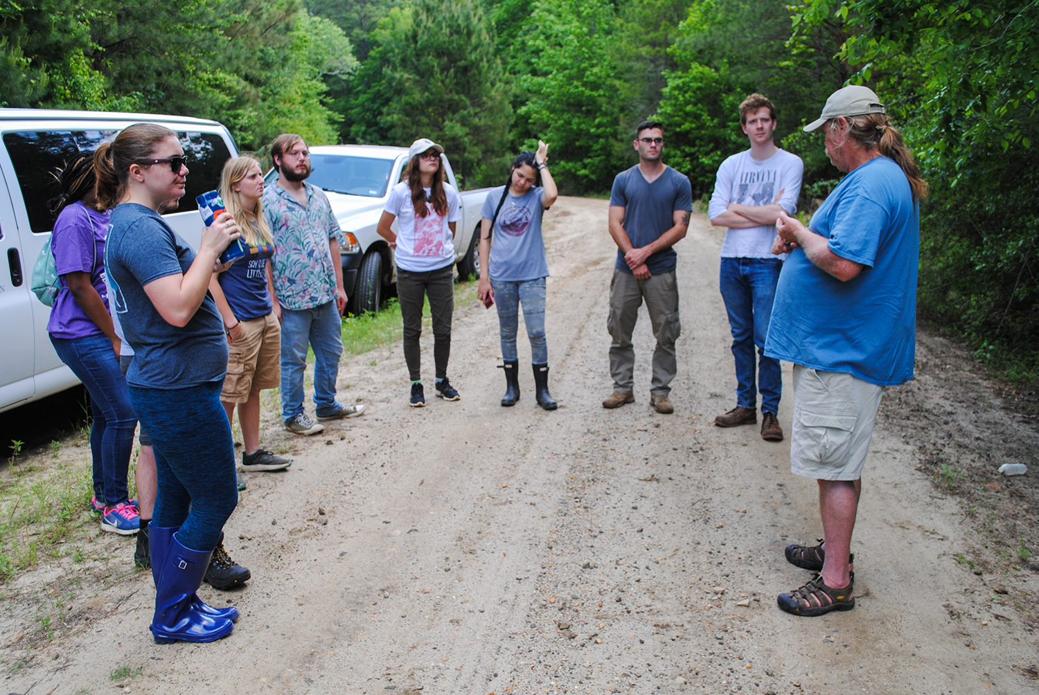 Students listen to Peter Loos talk about his plant explorations at Little Cow Creek.
