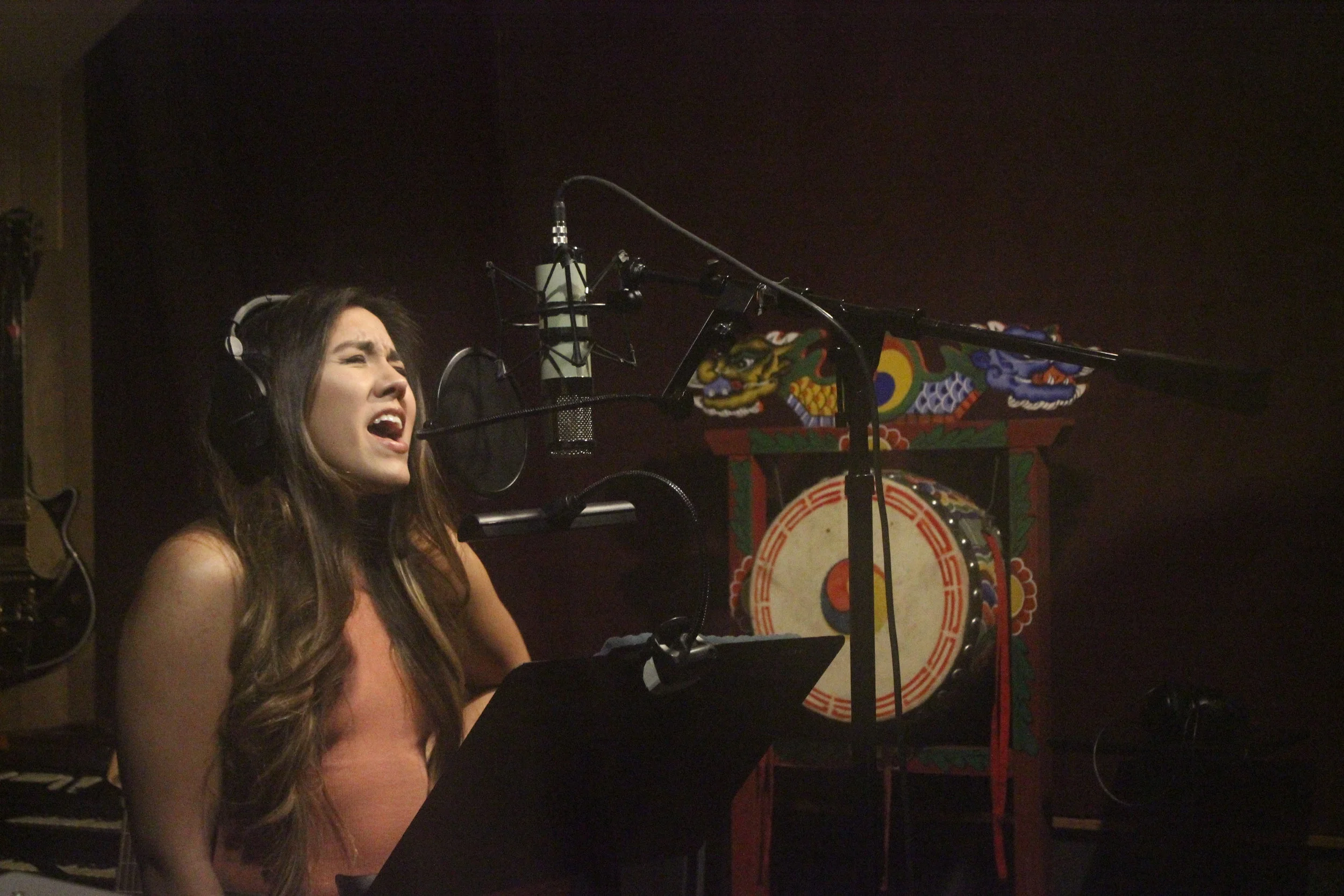 Andie Paredes, shown recording tracks for her EP album, found her gift of singing in her school's first-grade choir.