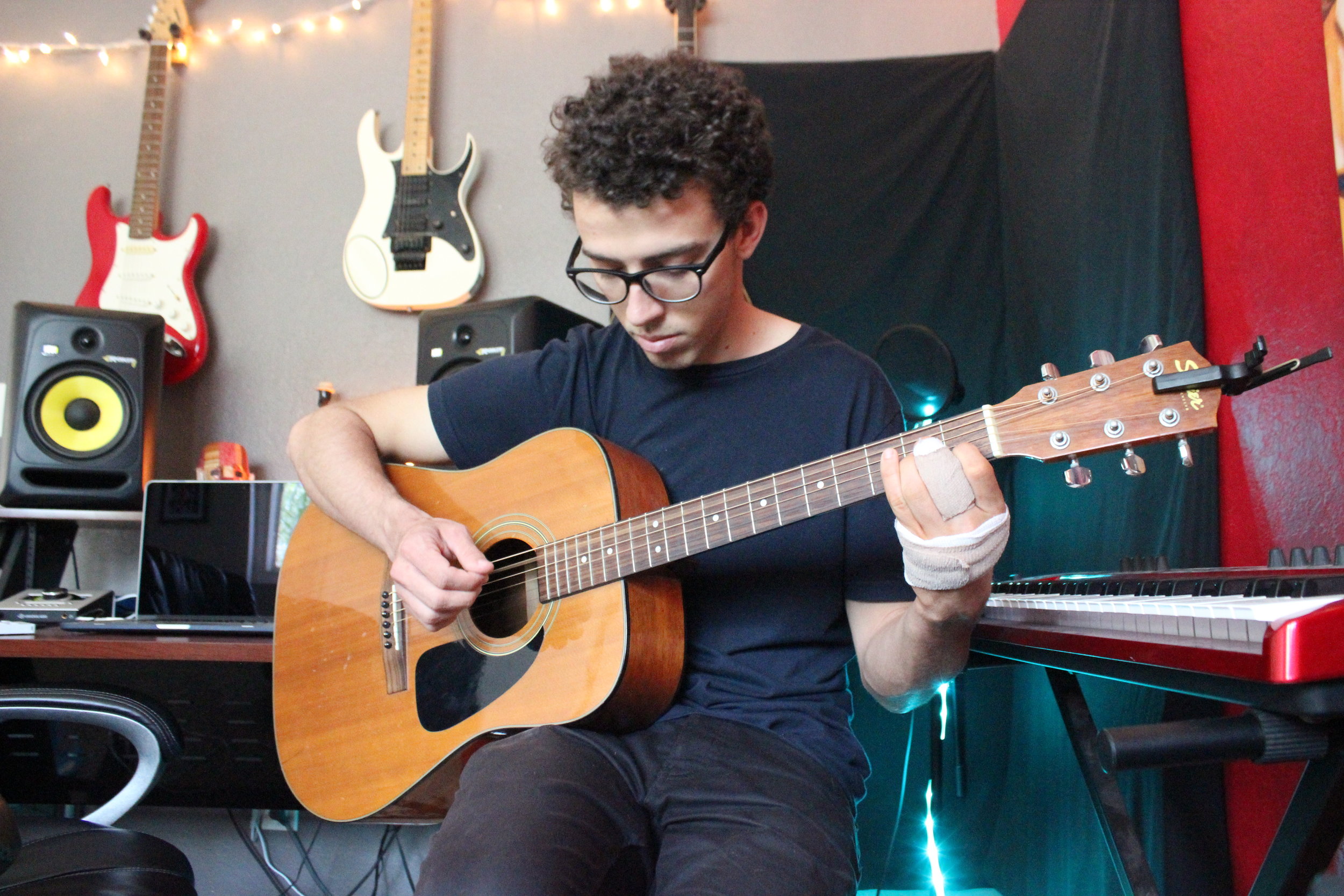 Adam Yocum, CSULB junior, is the typical one-man band when recording his music.