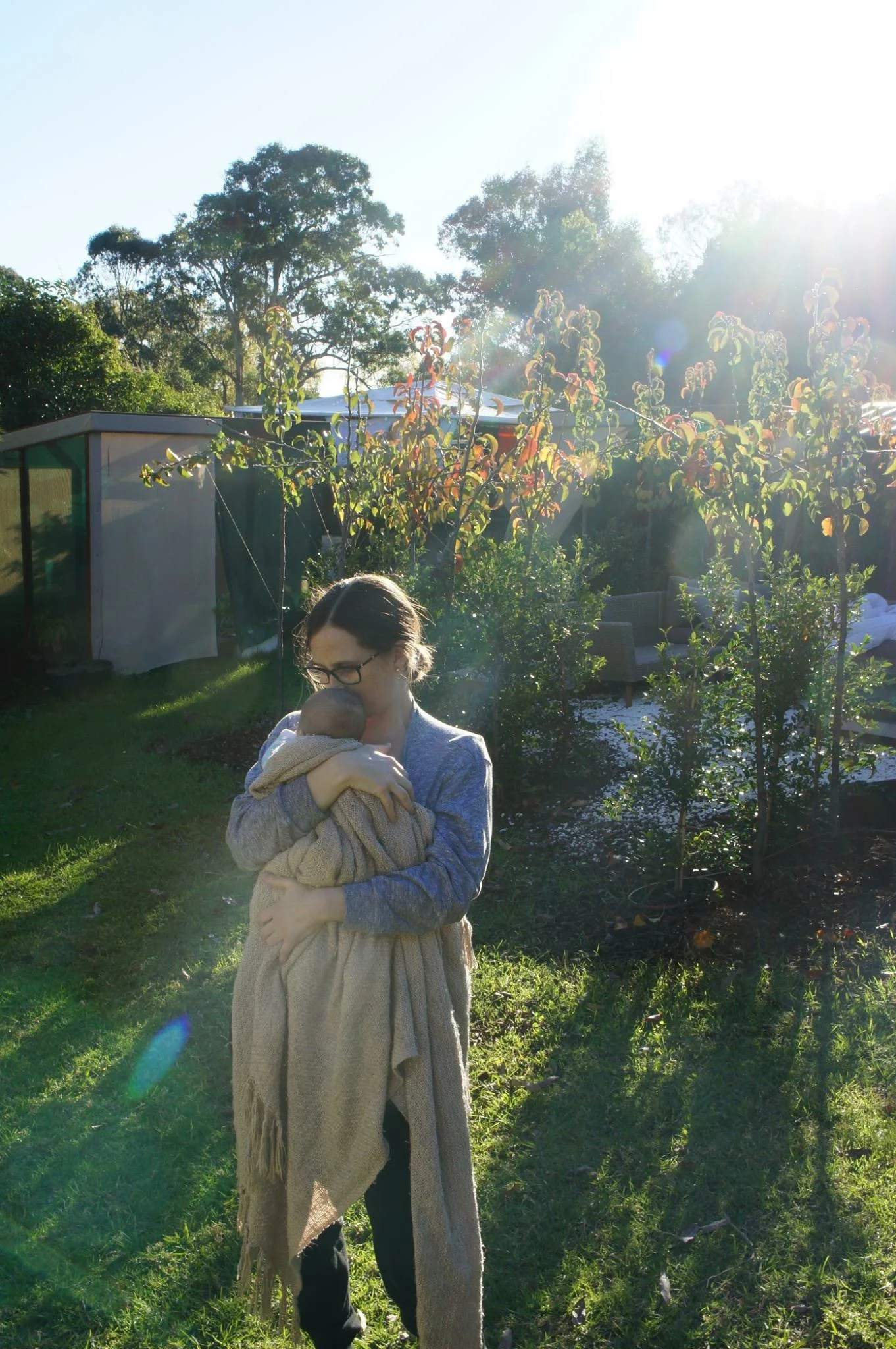 Introducing our son to the chooks and the garden