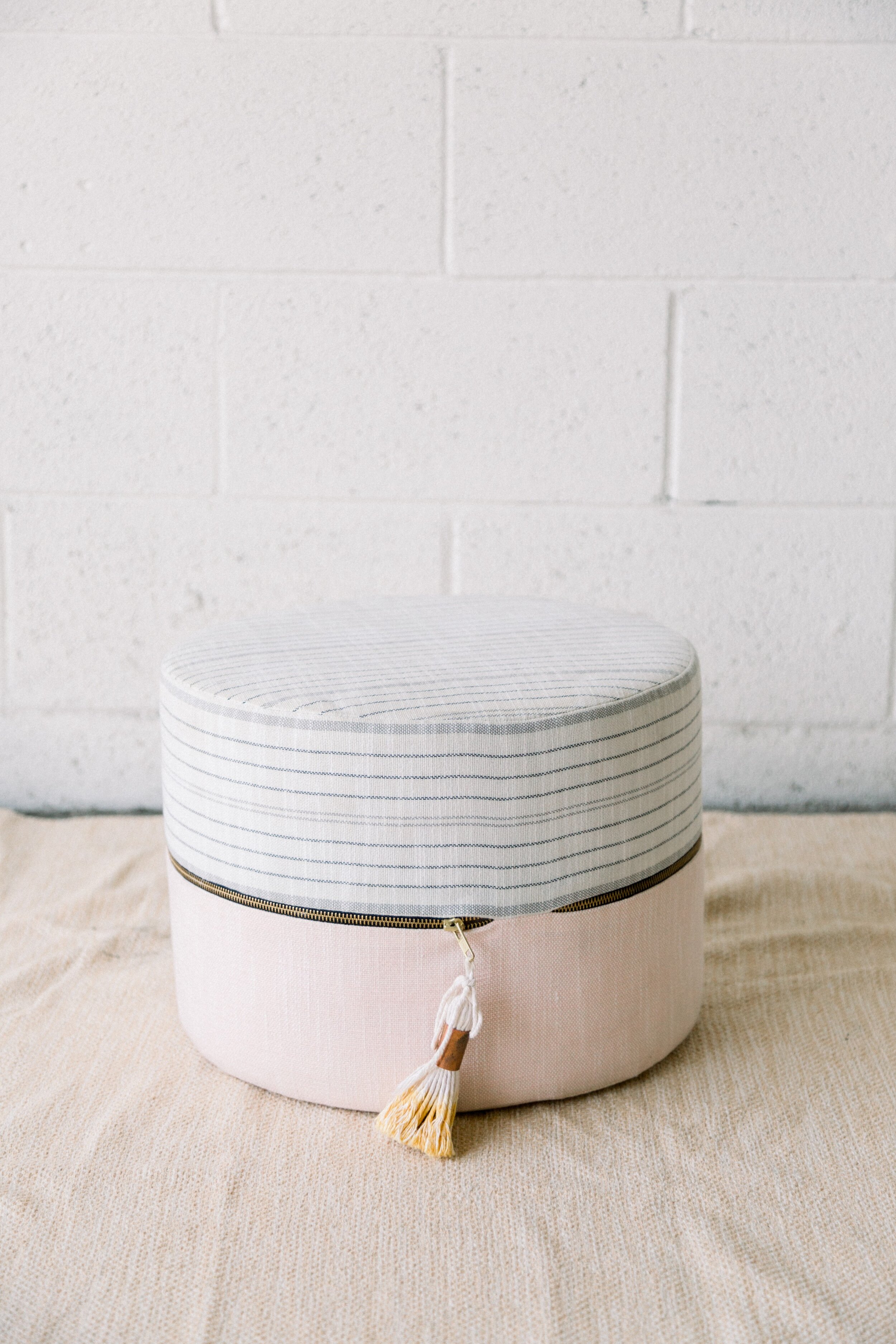 Harper Pink and Grey Ottoman with Tassel