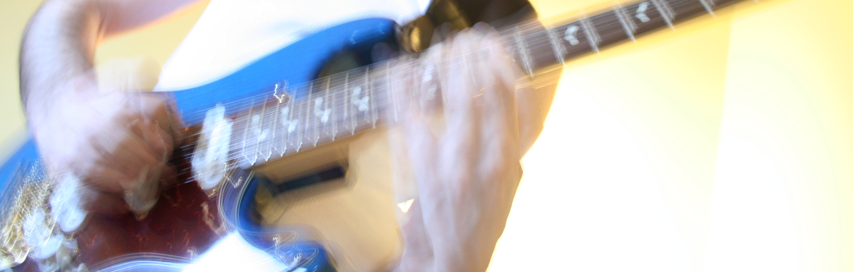 hands on guitar neck.jpg