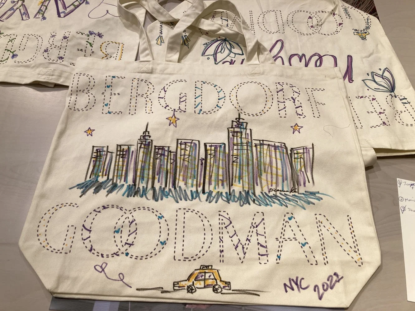 Deanna Kei live bag painting for Bergdorf Goodman
