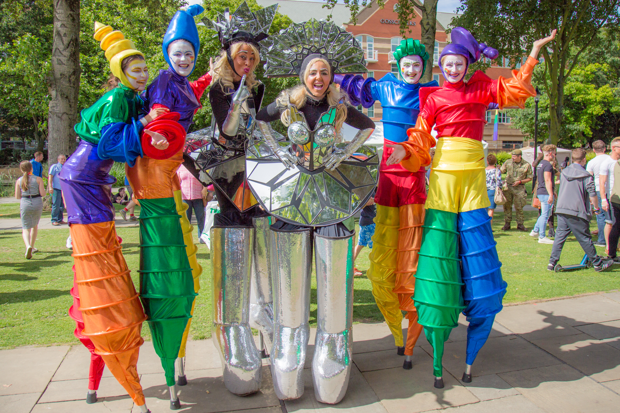 The gorgeous girls and rainbow stilt walkers