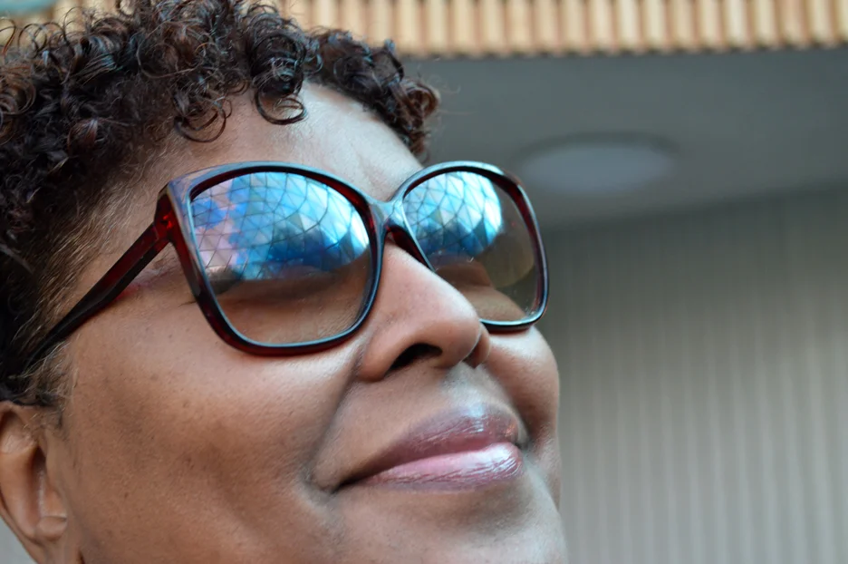 The Center's geodesic dome reflected in Dee's glasses