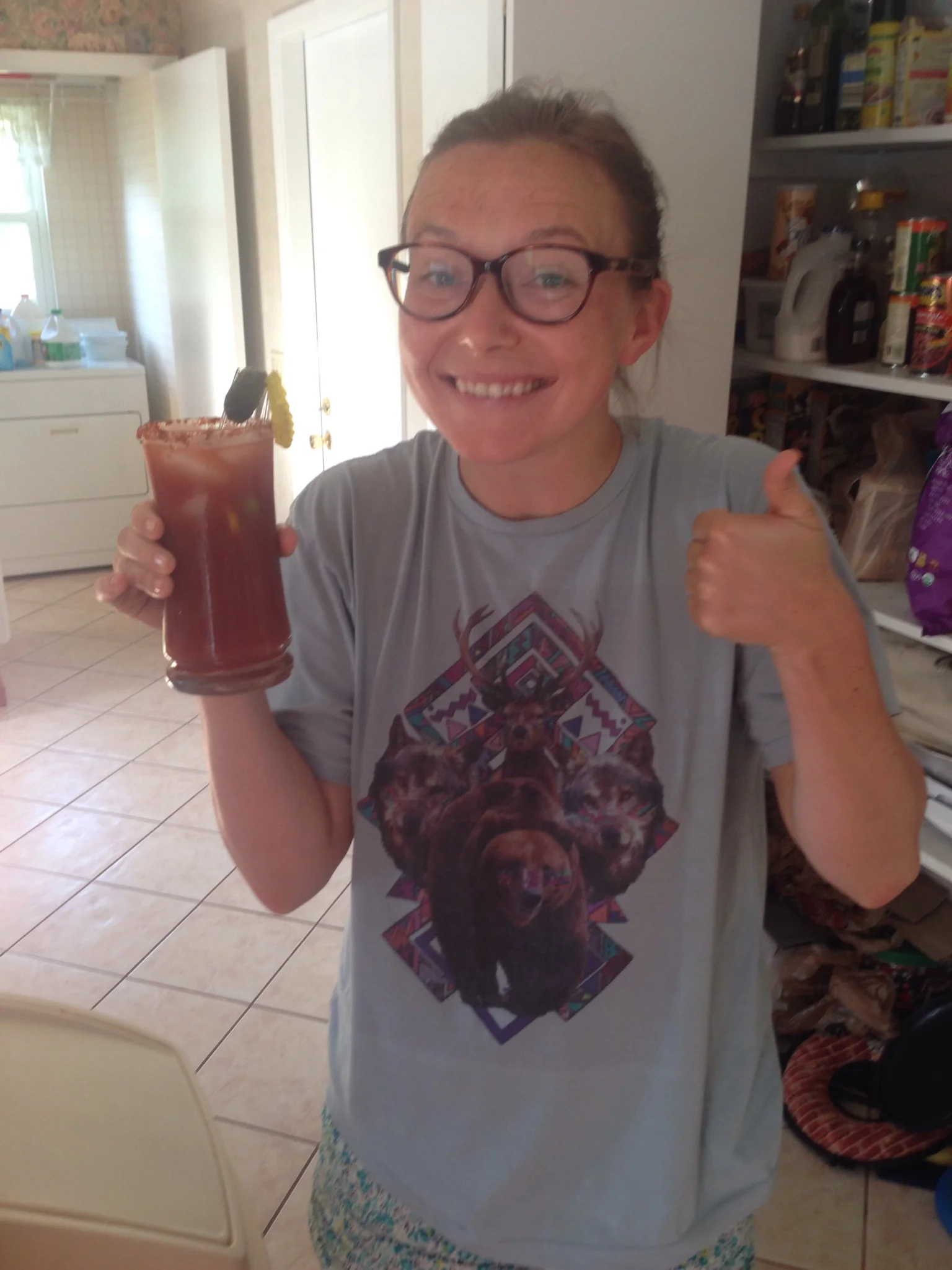 Alex enjoys her bloody mary. Her shirt embodies the #aintnuthinbutmammals theme. 