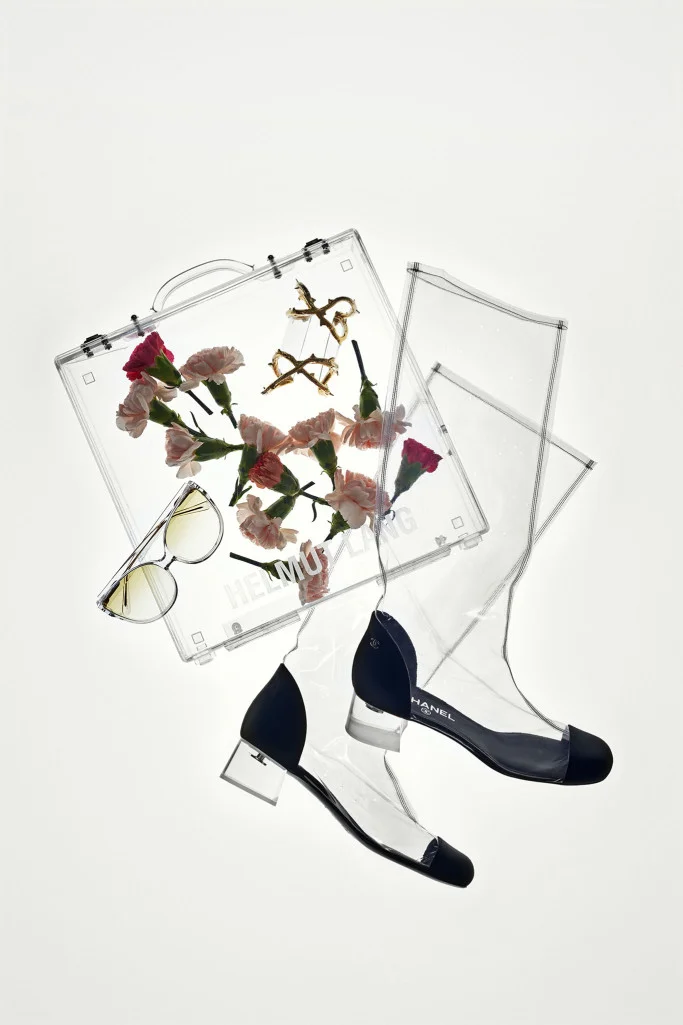 Helmut Lang briefcase, Chanel boots, Balmain cuff and Linda Farrow sunglasses ( Photo Joshua Scott / WWD)