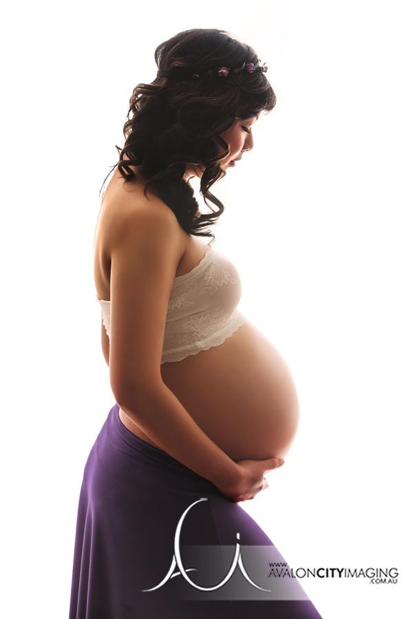 Maternity photograph of lady in purple skirt