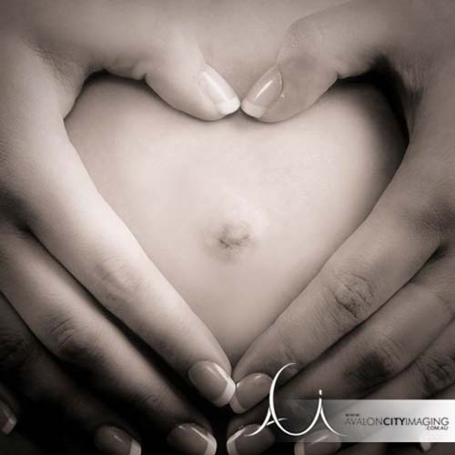 Maternity photography with love shaped hands