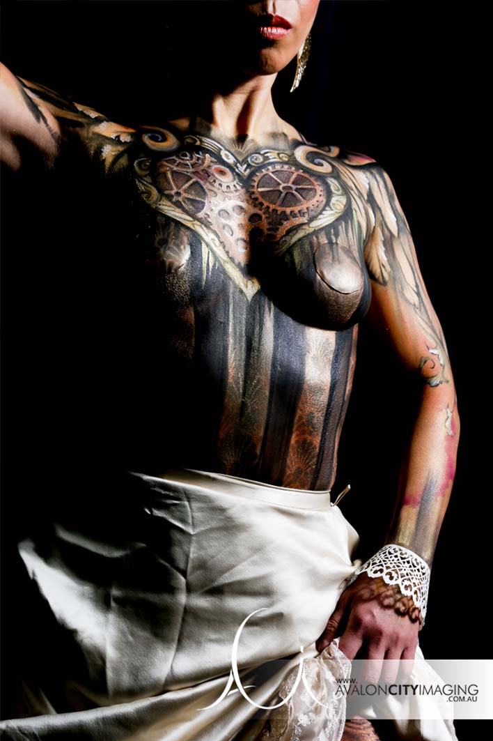 body art photography - steam punk style black and gold body painting with bright directional studio lighting.jpg