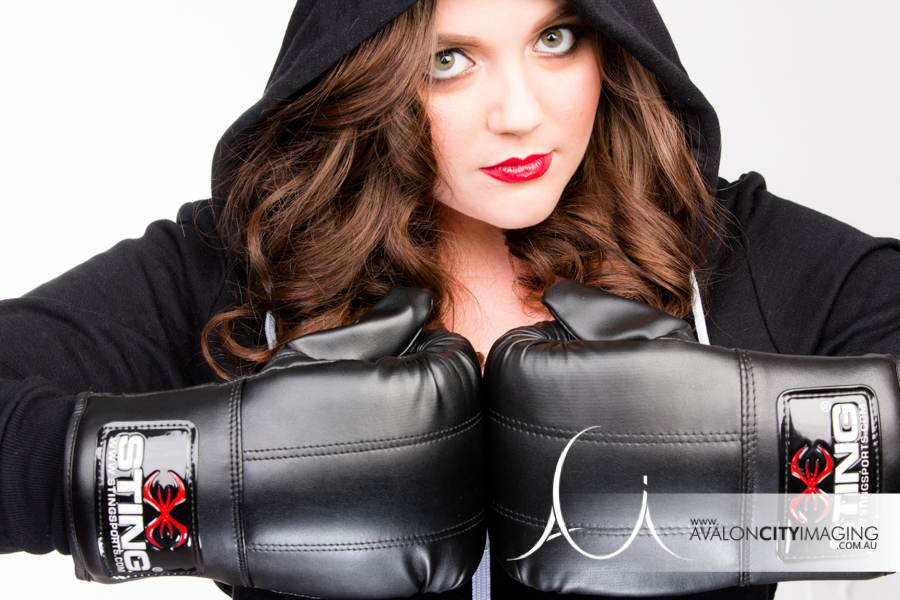 Sometimes it's what you don't show thats sexy! This badass babe decided on boxing gloves and a hoodie for a deadly photoshoot experience!