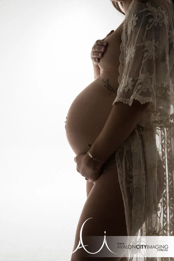 maternity photography - expecting mother in classic side‑profile pose.jpg