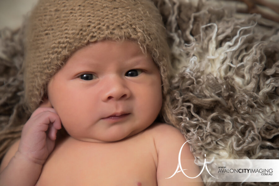 Newborn photography – baby staring right at the camera